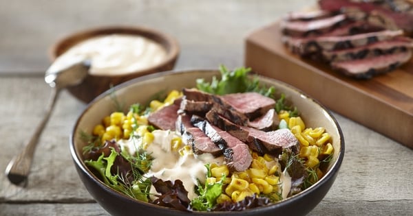Mixed greens, corn and beef bowl