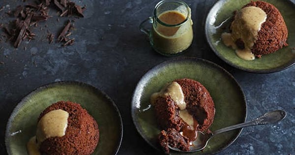 Chocolate and banana molten cakes with hazelnut and date sauce