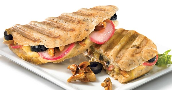 Hummus and caramelized almond sandwich