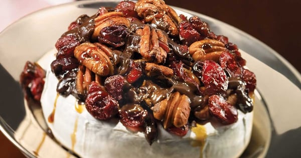Warm Brie with pecan, cranberry and dark chocolate topping