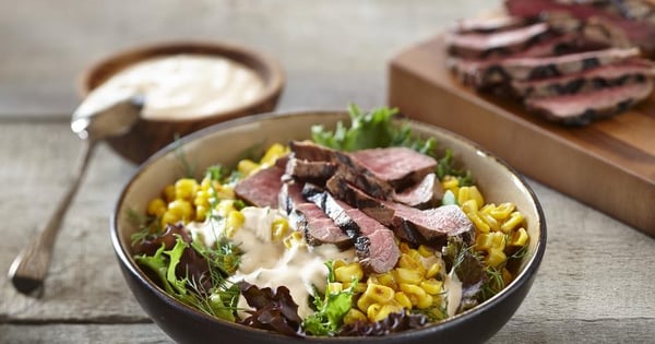 Mixed greens, corn and beef bowl