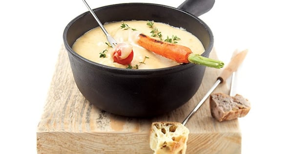 Fondue meal with a tray of grilled vegetables