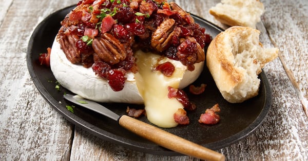 Melted brie with cranberries, bacon and pecans