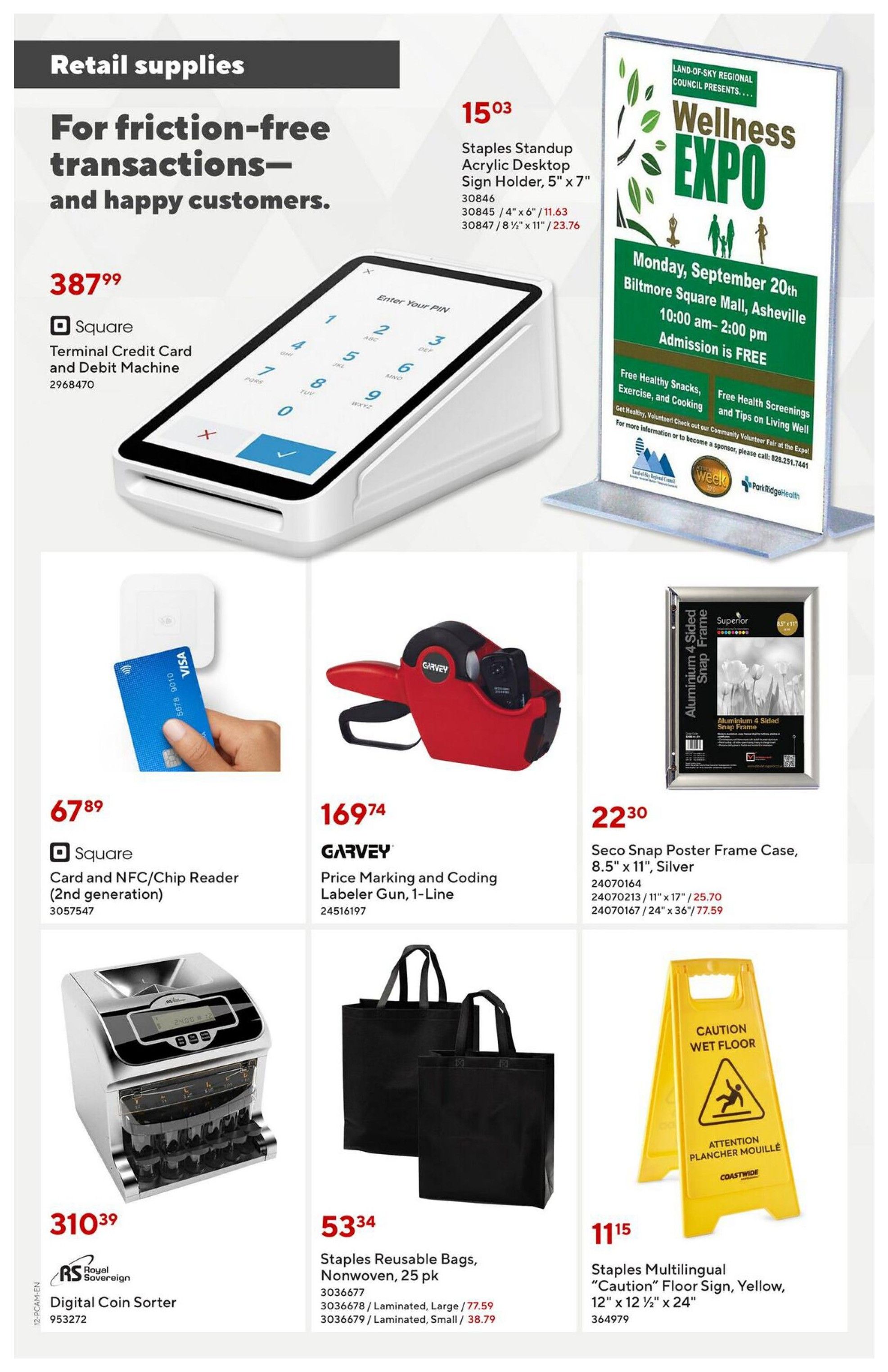 Staples flyer page 12 features retail supplies for smooth transactions. Products include a Square Terminal Credit Card and Debit Machine for $387.99, and a Square Card and NFC/Chip Reader (2nd generation) for $67.89. Also available is a Garvey Price Marking and Coding Labeler Gun, 1-Line, for $169.74. For organization, find Staples Reusable Bags, Nonwoven, 25 pk, with large laminated bags at $77.59 and small laminated bags at $38.79. A Royal Sovereign Digital Coin Sorter is priced at $310.39. Other items include Staples Standup Acrylic Desktop Sign Holders in 5' x 7' for $11.63 and 8 1/2' x 11' for $23.76. Seco Snap Poster Frame Cases are available in Silver, 8.5' x 11' for $25.70, 11' x 17' for $25.70, and 24' x 36' for $77.59. A Coastwide Staples Multilingual 'Caution' Floor Sign (Yellow, 12' x 12 1/2' x 24') is $11.15. The page also advertises the Land-of-Sky Regional Council Wellness Expo on Monday, September 20th, at Biltmore Square Mall, Asheville, from 10:00 am to 2:00 pm, with free admission and free healthy snacks, exercise, and cooking sessions, as well as free health screenings and tips on living well.