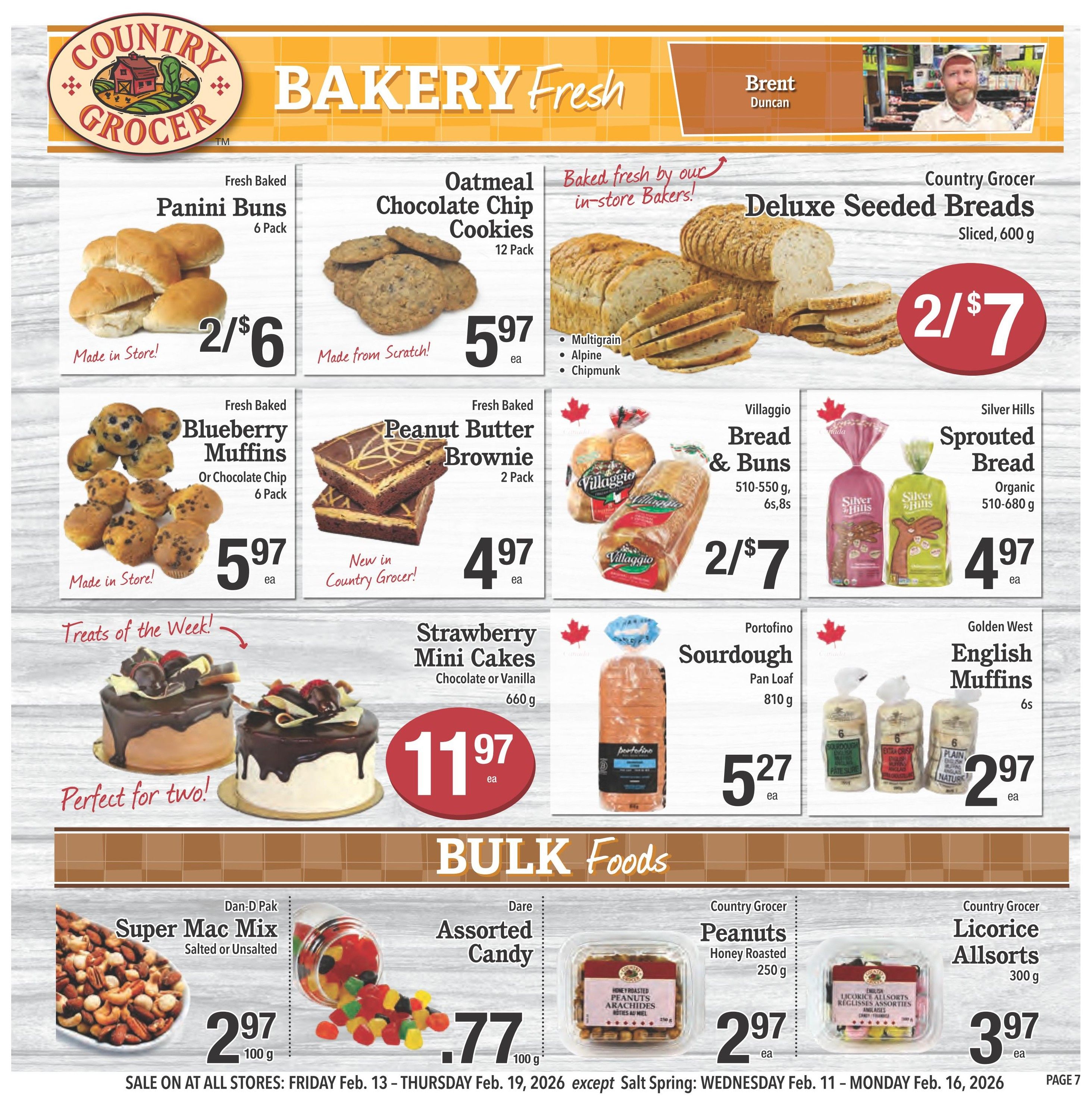 Country Grocer weekly flyer specials page 7 features bakery fresh items and bulk foods. Bakery items include fresh baked Panini Buns, 6 pack, for 2 for $6; Oatmeal Chocolate Chip Cookies, 12 pack, for $5.97 each; Deluxe Seeded Breads, sliced, 600g, for 2 for $7, with options for Multigrain, Alpine, and Chipmunk. Also available are fresh baked Blueberry Muffins or Chocolate Chip Muffins, 6 pack, for $5.97 each, and fresh baked Peanut Butter Brownie, 2 pack, for $4.97 each. Treats of the Week include Strawberry Mini Cakes, Chocolate or Vanilla, 660g, for $11.97 each. Bread options include Villaggio Bread & Buns, 510-550g, 6s/8s, for 2 for $7, and Silver Hills Sprouted Bread, organic, 510-680g, for $4.97 each. Portofino Sourdough Pan Loaf, 810g, is $5.27 each, and Golden West English Muffins, 6s, are $2.97 each. Bulk Foods include Dan-D-Pak Super Mac Mix, salted or unsalted, 100g, for $2.97 each; Dare Assorted Candy, 100g, for $0.77 each; Country Grocer Honey Roasted Peanuts, 250g, for $2.97 each; and Country Grocer Licorice Allsorts, 300g, for $3.97 each. Sale is on at all stores from Friday, February 13 to Thursday, February 19, 2026, except Salt Spring which is Wednesday, February 11 to Monday, February 16, 2026.