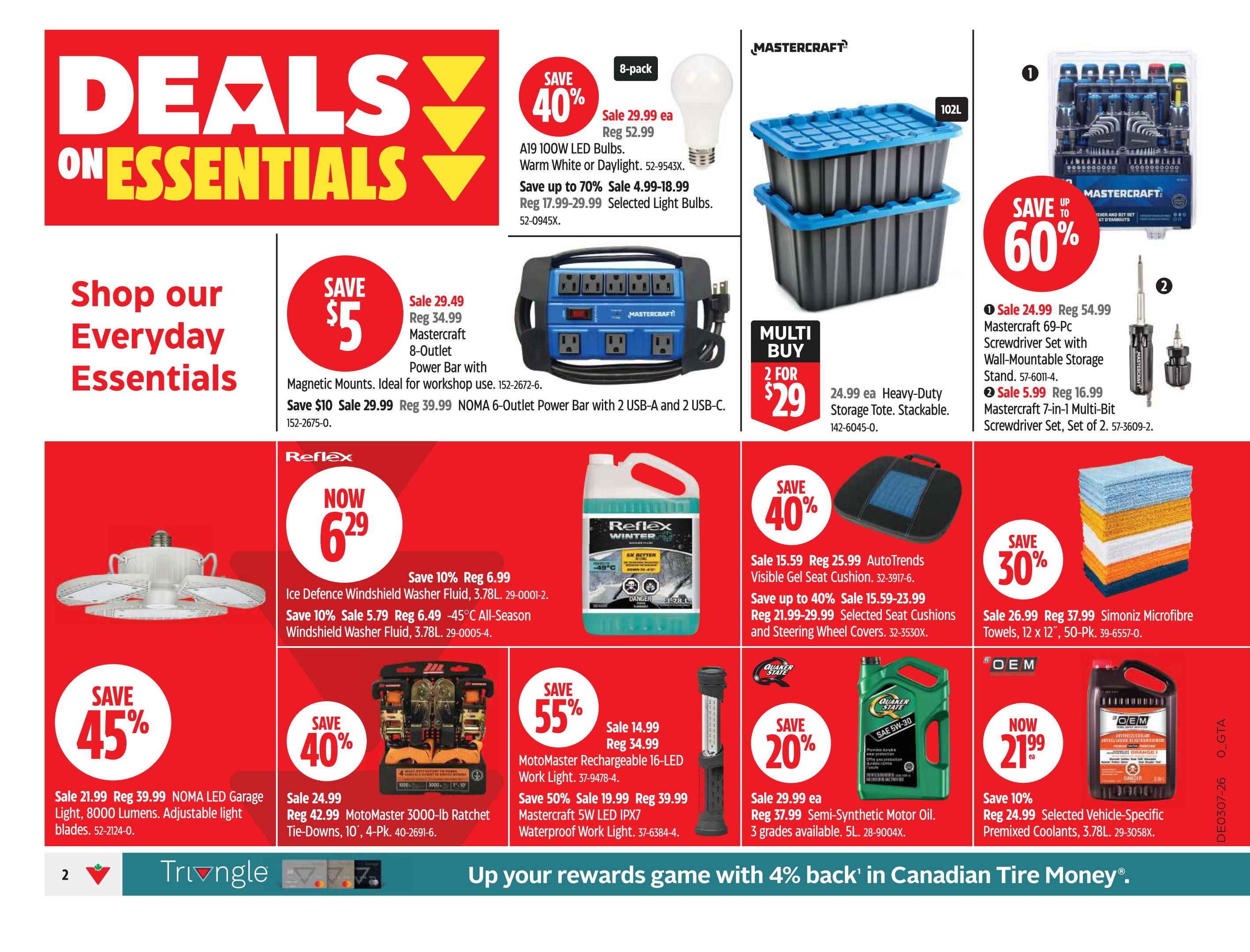 Canadian Tire flyer page 2 featuring 'Deals on Essentials'. Offers include: A19 100W LED Bulbs (Warm White or Daylight) on sale for $29.99 (save up to 70%, reg $52.99), with selected bulbs on sale for $4.99-$18.99. Mastercraft 8-Outlet Power Bar with Magnetic Mounts on sale for $29.99 (reg $34.99). NOMA 6-Outlet Power Bar with 2 USB-A and 2 USB-C ports on sale for $29.99 (save $10, reg $39.99). Multi-buy deal: 2 for $29 on Heavy-Duty Storage Totes (reg $24.99 ea). Mastercraft 69-Pc Screwdriver Set with Wall-Mountable Storage Stand on sale for $24.99 (reg $54.99). Mastercraft 7-in-1 Multi-Bit Screwdriver Set on sale for $5.99 (reg $16.99). Save 45% on NOMA LED Garage Light, 8000 Lumens, Adjustable light blades, on sale for $21.99 (reg $39.99). Mastercraft 3000-lb Ratchet Tie-Downs, 10', 4-Pk. on sale for $24.99 (reg $42.99). Save 55% on MotoMaster Rechargeable 16-LED Work Light, on sale for $14.99 (reg $34.99). Save 50% on Mastercraft 5W LED IPX7 Waterproof Work Light, on sale for $19.99 (reg $39.99). Save 40% on AutoTrends Visible Gel Seat Cushion, on sale for $15.59 (reg $25.99). Save up to 40% on Selected Seat Cushions and Steering Wheel Covers, on sale for $15.59-$23.99 (reg $21.99-$29.99). Save 30% on Simoniz Microfibre Towels, 12' x 12', 50-Pk. on sale for $26.99 (reg $37.99). Save 20% on Quaker State Semi-Synthetic Motor Oil, 3 grades available, 5L, on sale for $29.99 ea (reg $37.99). Save 10% on Selected Vehicle-Specific Pre-mixed Coolants, 3.78L, on sale for $21.99 ea (reg $24.99). Reflex Ice Defence Windshield Washer Fluid, 3.78L, on sale for $6.29 (save 10%, reg $6.99). Save 10% on All-Season Windshield Washer Fluid, 3.78L, on sale for $5.79 (reg $6.49).