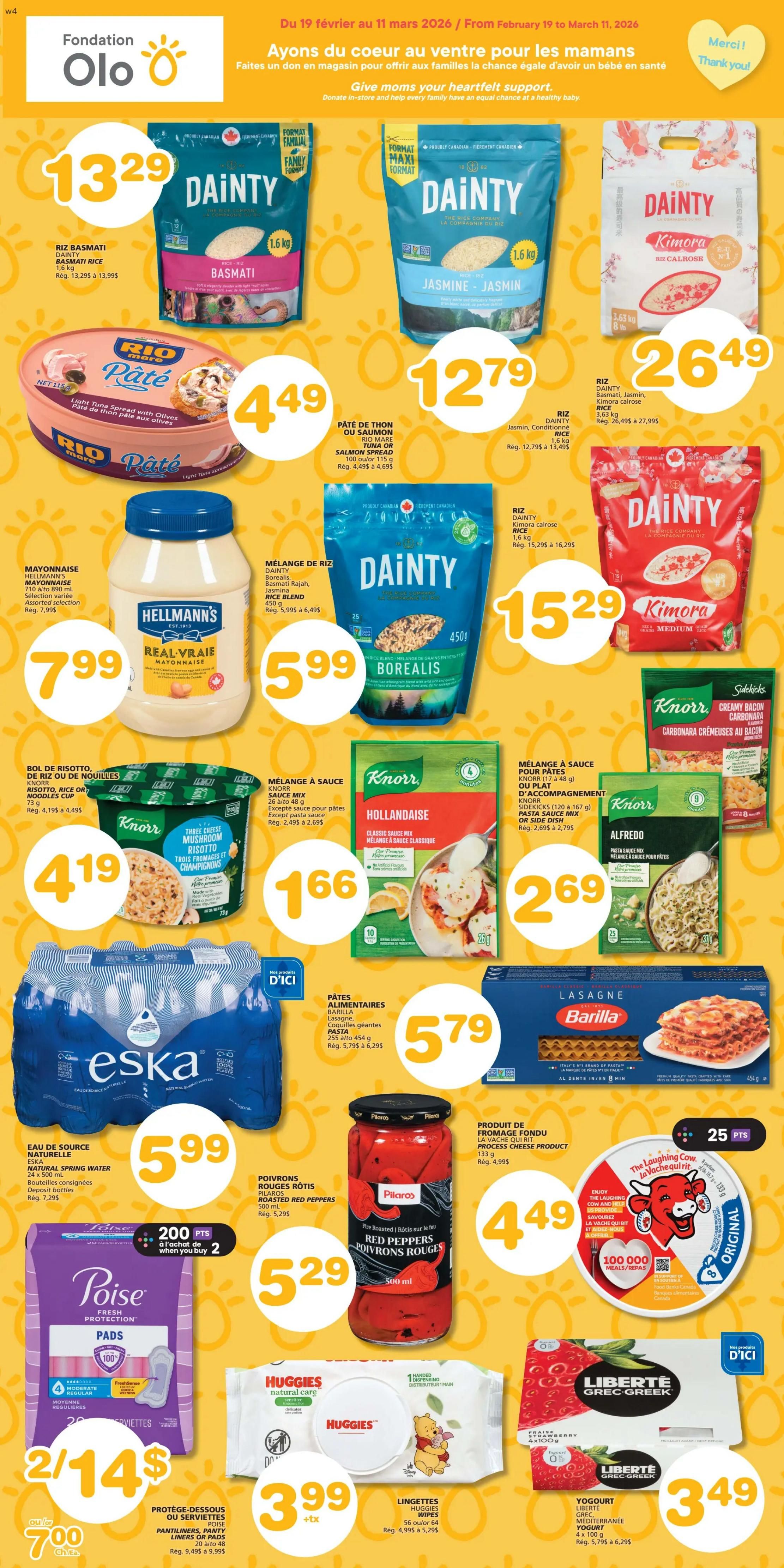 Marchés Tradition weekly flyer specials, page 8. Featured products include Dainty Basmati Rice for $13.29, Dainty Jasmine Rice for $12.79, and Dainty Kimora Calrose Rice for $26.49. Also on sale is Rio Mare Tuna Spread with Olives for $4.49. Hellmann's Real Mayonnaise is $7.99. Dainty Borealis Rice Blend is $5.99. Knorr Risotto Three Cheese Mushroom cup is $4.19. Knorr Hollandaise Sauce Mix is $1.66. Knorr Alfredo Pasta Sauce Mix is $2.69. Eska Natural Spring Water (24 x 500 mL) is $5.99. Barilla Lasagna is $5.79. Pilaros Roasted Red Peppers are $5.29. The Laughing Cow Process Cheese Product is $4.49 and includes a promotion for 25 points. Poise Pantyliners or Pads are 2 for $14 or $7.00 each, with a bonus of 200 points when you buy 2. Huggies Natural Care Wipes are $3.99. Liberté Grec Greek Mediterranean Yogurt (4 x 100 g) is $3.49.