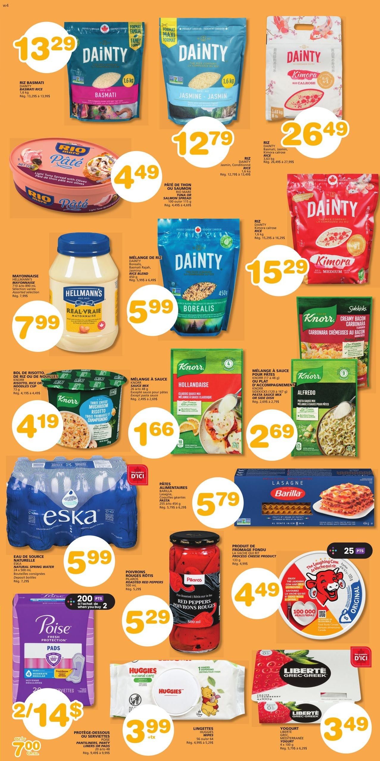 Marchés Tradition flyer page 8 specials include Dainty Basmati Rice 1.6 kg for $13.29, Dainty Jasmine Rice 1.6 kg for $12.79, Dainty Kimora Calrose Rice 3.63 kg for $26.49, Rio Mare Tuna or Salmon Spread 100g for $4.49, Hellmann's Mayonnaise 710 mL for $7.99, Dainty Borealis Rice Blend 450g for $5.99, Knorr Risotto Cup 73g for $4.19, Knorr Hollandaise Sauce Mix for $1.66, Knorr Alfredo Pasta Sauce Mix for $2.69, Barilla Lasagna Pasta 454g for $5.79, Eska Natural Spring Water 2 x 500 mL for $5.99, Pilos Roasted Red Peppers 500 mL for $5.29, The Laughing Cow Cheese Product 133g for $4.49 with 25 bonus points, Poise Pads 20-48 units for 2 for $14 or $7.00 each, Huggies Wipes 56-64 units for $3.99, and Liberté Greek Yogurt 4 x 100g for $3.49.