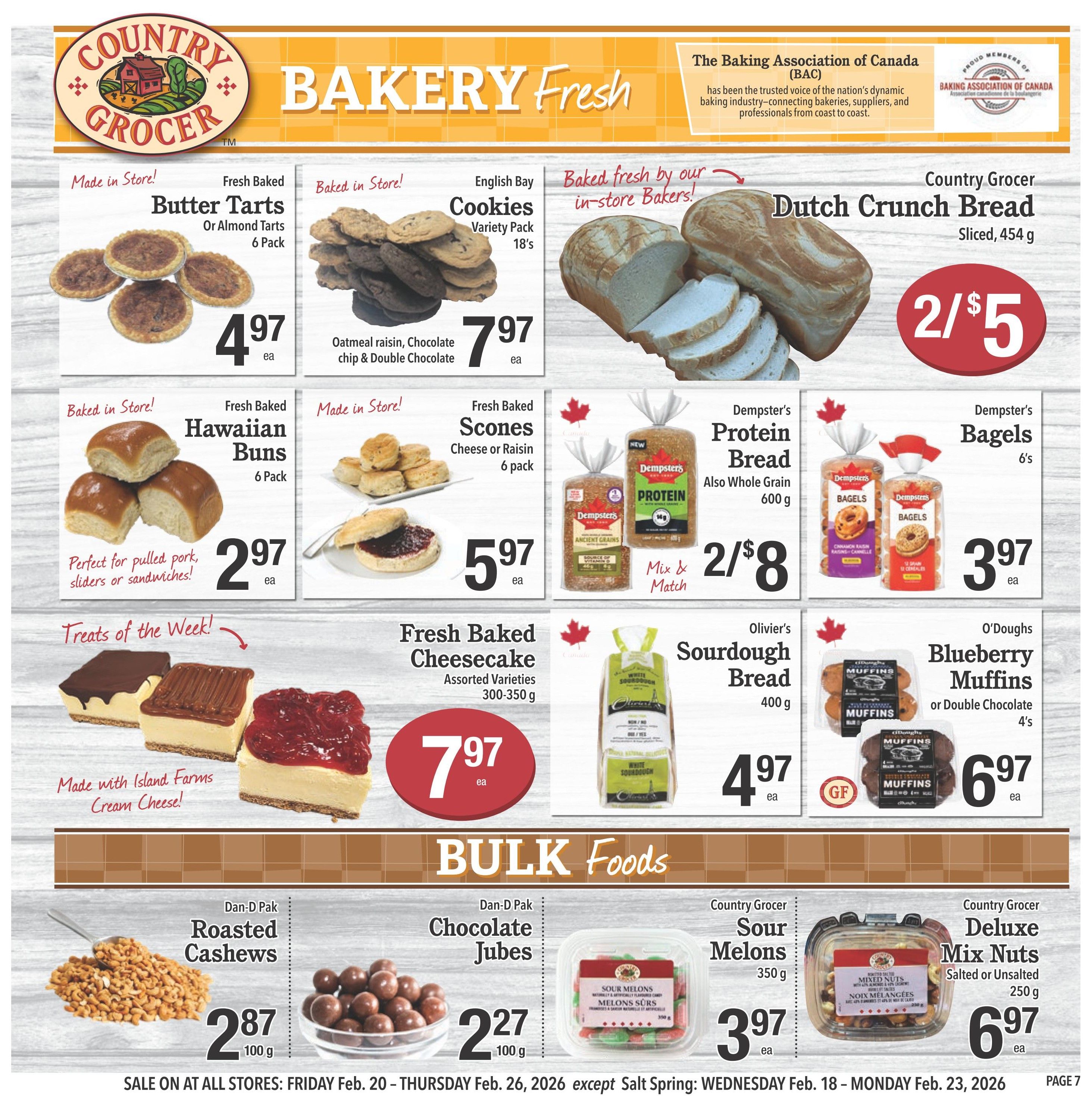 Country Grocer Weekly Flyer Specials Page 7 features a variety of fresh baked goods and bulk foods. Highlights include Fresh Baked Butter Tarts or Almond Tarts 6 Pack for $4.97, English Bay Cookies Variety Pack 18's for $7.97, and Country Grocer Dutch Crunch Bread sliced for 2 for $5. Also available are Fresh Baked Hawaiian Buns 6 Pack for $2.97, Fresh Baked Scones Cheese or Raisin 6 pack for $5.97, Dempster's Protein Bread Whole Grain 600g for 2 for $8, and Dempster's Bagels 6's for $3.97. Treats of the Week include Fresh Baked Cheesecake Assorted Varieties 300-350g for $7.97, made with Island Farms Cream Cheese. Olivier's Sourdough Bread 400g is $4.97, and O'Doughs Blueberry Muffins or Double Chocolate Muffins 4's are $6.97. In the Bulk Foods section, find Dan-D Pak Roasted Cashews 100g for $2.87, Dan-D Pak Chocolate Jubes 100g for $2.27, Country Grocer Sour Melons 350g for $3.97, and Country Grocer Deluxe Mix Nuts Salted or Unsalted 250g for $6.97. Sale runs Friday, Feb. 20 to Thursday, Feb. 26, 2026.