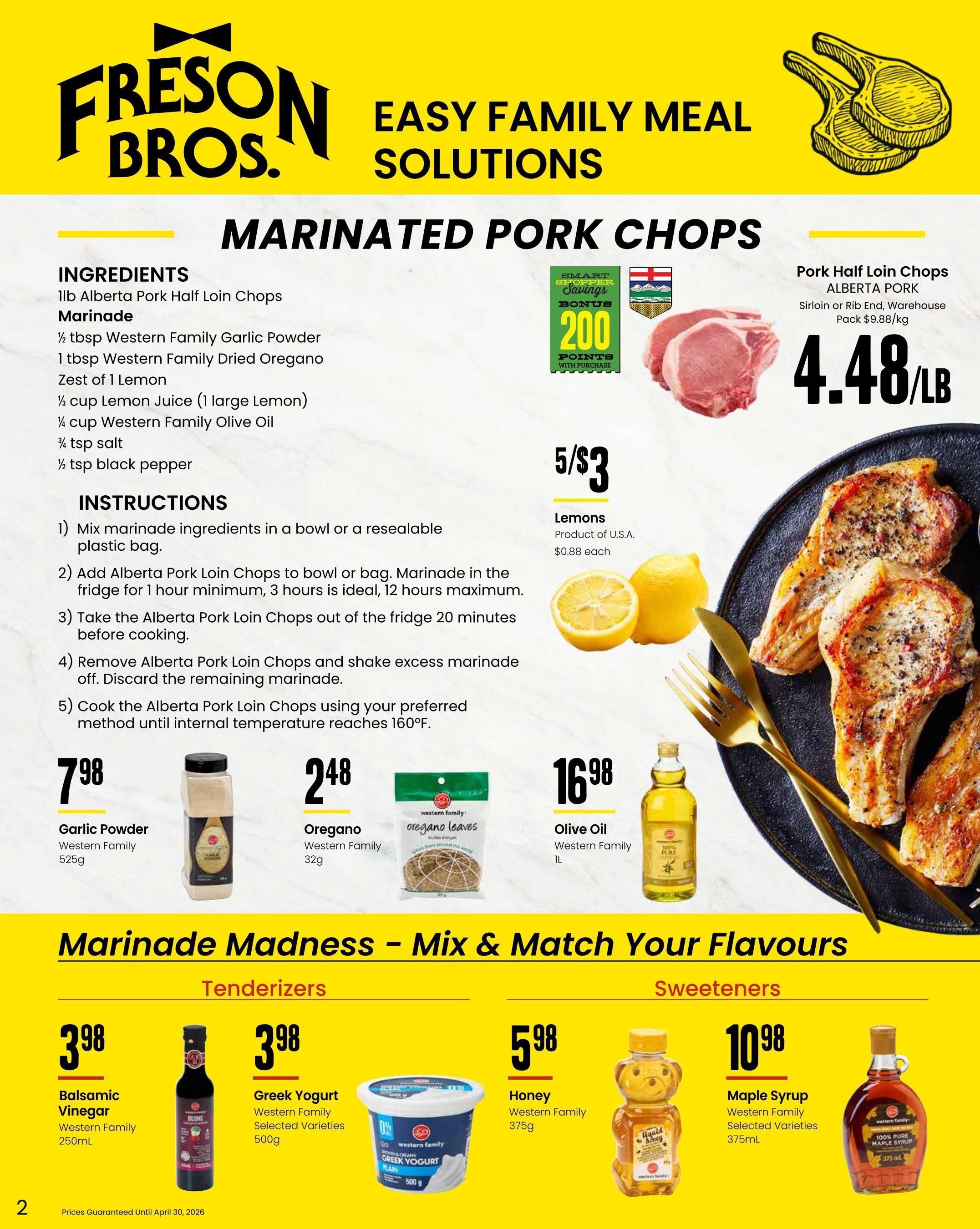 Freson Bros. flyer page 2 features 'Easy Family Meal Solutions' with a focus on marinated pork chops. The page includes a recipe for Alberta Pork Half Loin Chops marinade using Western Family Garlic Powder ($7.98/525g), Western Family Dried Oregano ($2.48/32g), lemons, and Western Family Olive Oil ($16.98/1L). Pork Half Loin Chops (Alberta Pork, Sirloin or Rib End, Warehouse Pack) are priced at $4.48/lb. Lemons are on sale for 5 for $3, or $0.88 each. The 'Marinade Madness - Mix & Match Your Flavours' section offers Tenderizers: Western Family Balsamic Vinegar ($3.98/250mL) and Western Family Greek Yogurt Selected Varieties ($3.98/500g). Sweeteners include Western Family Honey ($5.98/375g) and Western Family Maple Syrup Selected Varieties ($10.98/375mL). Prices are guaranteed until April 30, 2026.