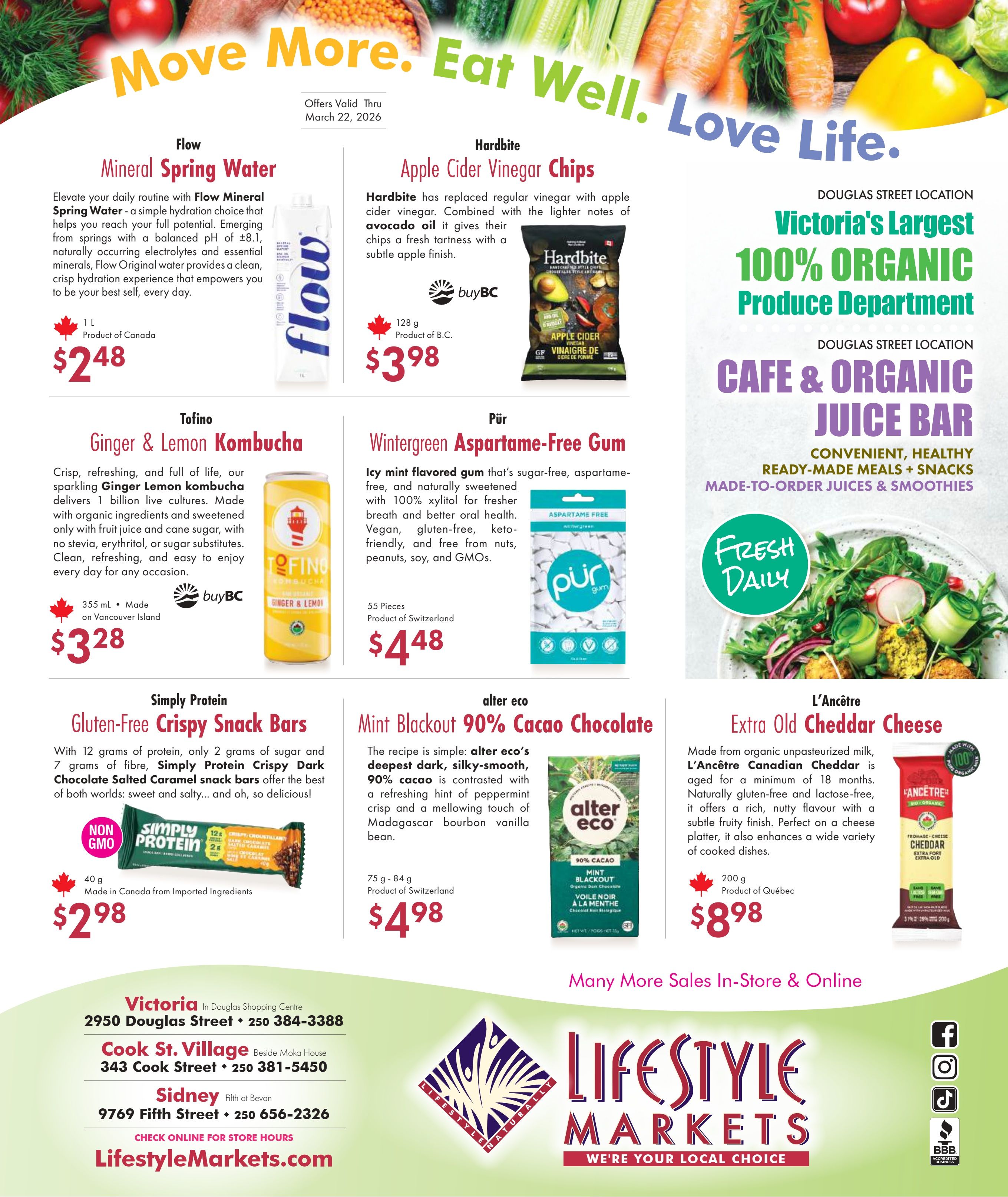 Lifestyle Markets flyer page 2 features Flow Mineral Spring Water for $2.48, Hardbite Apple Cider Vinegar Chips for $3.98, Tofino Ginger & Lemon Kombucha for $3.28, Pür Wintergreen Aspartame-Free Gum for $4.48, Simply Protein Gluten-Free Crispy Dark Chocolate Salted Caramel Snack Bars for $2.98, Alter Eco Mint Blackout 90% Cacao Chocolate for $4.98, and L'Ancêtre Extra Old Cheddar Cheese for $8.98. The flyer also highlights the Douglas Street location's Victoria's Largest 100% Organic Produce Department and Cafe & Organic Juice Bar. Store locations and contact information are provided for Victoria, Cook St. Village, and Sidney. Offers valid thru March 22, 2026.