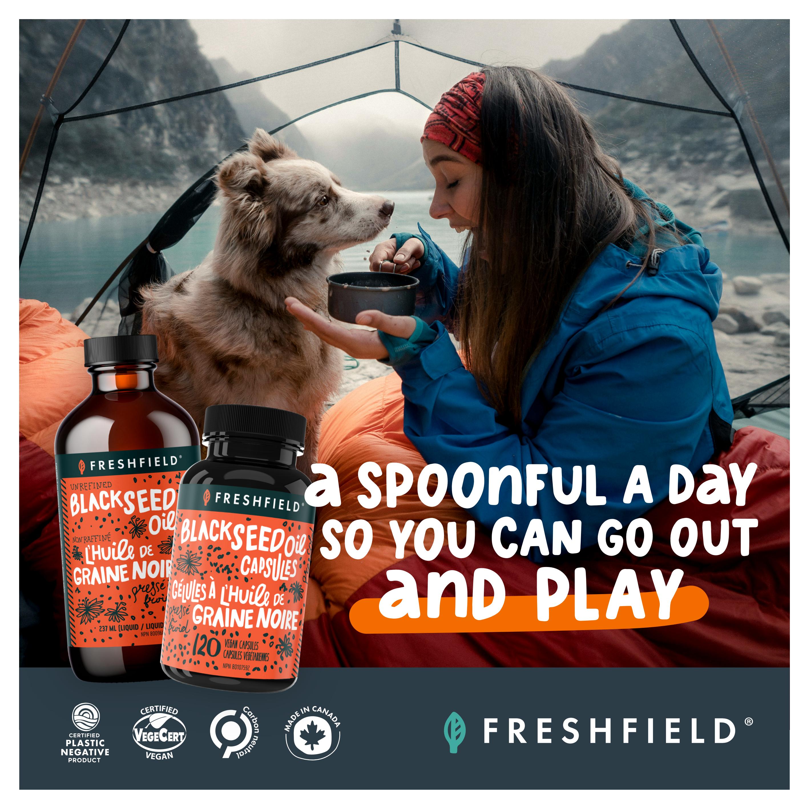 Goodness Me! flyer page 12 featuring Freshfield brand Black Seed Oil. The page shows a bottle of Freshfield Unrefined Black Seed Oil liquid (237 ml) and a bottle of Freshfield Black Seed Oil Capsules (120 vegan capsules). The tagline reads 'A spoonful a day so you can go out and play'. Certifications shown include Certified Plastic Negative Product, Certified VegeCert Vegan, Carbon Neutral, and Made in Canada. The Freshfield logo is prominently displayed.