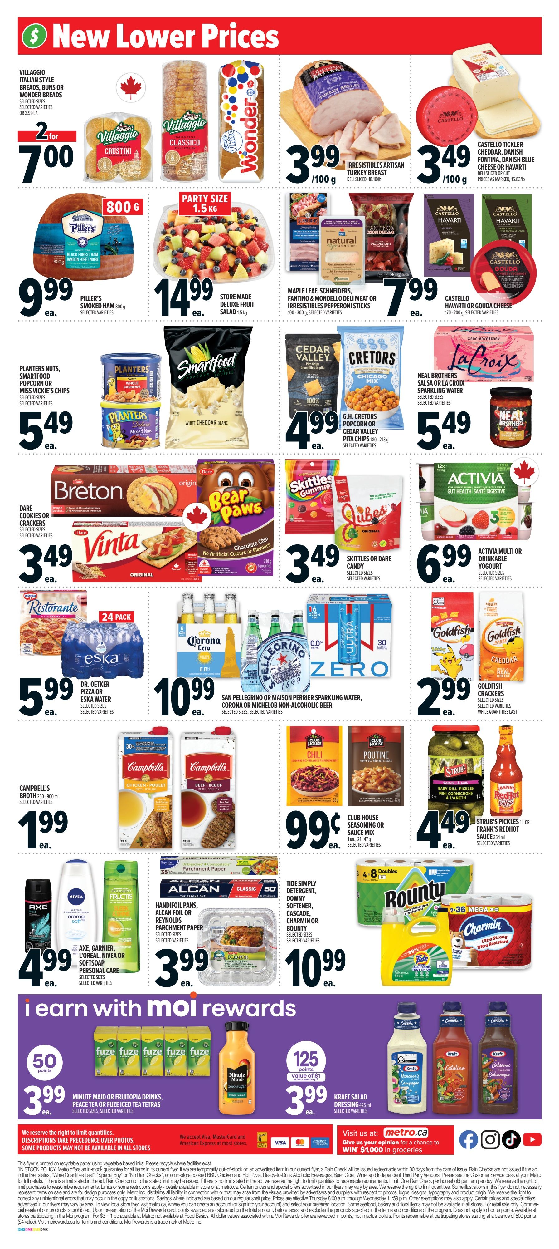 Metro Ontario weekly flyer specials page 7 features new lower prices on a variety of grocery items. Highlights include Villaggio Italian Style Breads, buns, or Wonder Breads for 2 for $7.00, Piller's Smoked Ham 800g for $9.99, and Store Made Deluxe Fruit Salad 1.5kg for $14.99. Also featured are Irresistibles Artisan Turkey Breast deli sliced for $3.99/100g, and Castello Tickler Cheddar, Danish Fontina, Blue Cheese or Havarti deli sliced for $3.49/100g. Snacks include Planters Nuts, Smartfood Popcorn or Miss Vickie's Chips for $5.49, G.H. Cretors Popcorn or Cedar Valley Pita Chips for $4.99, and Skittles or Dare Candy for $3.49. For baked goods, Dare Cookies or Crackers and Vinta are $3.49. Beverages on sale are Eska Water 24 pack for $5.99, San Pellegrino or Maison Perrier Sparkling Water, Corona or Michelob Non-Alcoholic Beer for $10.99. Other deals include Campbell's Broth 250-900ml for $1.99, Club House Seasoning or Sauce Mix for $0.99, and Strub's Pickles or Frank's RedHot Sauce for $4.49. Personal care items like Axe, Garnier, L'Oreal, Nivea or Softsoap are $4.99. Household items include Alcan Foil or Reynolds Parchment Paper for $3.99, and Tide Simply Detergent, Downy Softener, Cascade, Charmin or Bounty for $10.99. Also available are Goldfish Crackers for $2.99. The flyer also promotes 'I earn with Moi Rewards' with Minute Maid or Fruitoria Drinks, Peace Tea or Iced Tea Tetras for 50 points and $3.99, and Kraft Salad Dressing for 125 points and $3.99. The bottom of the page includes details on Moi Rewards and a chance to win $1,000 in groceries.