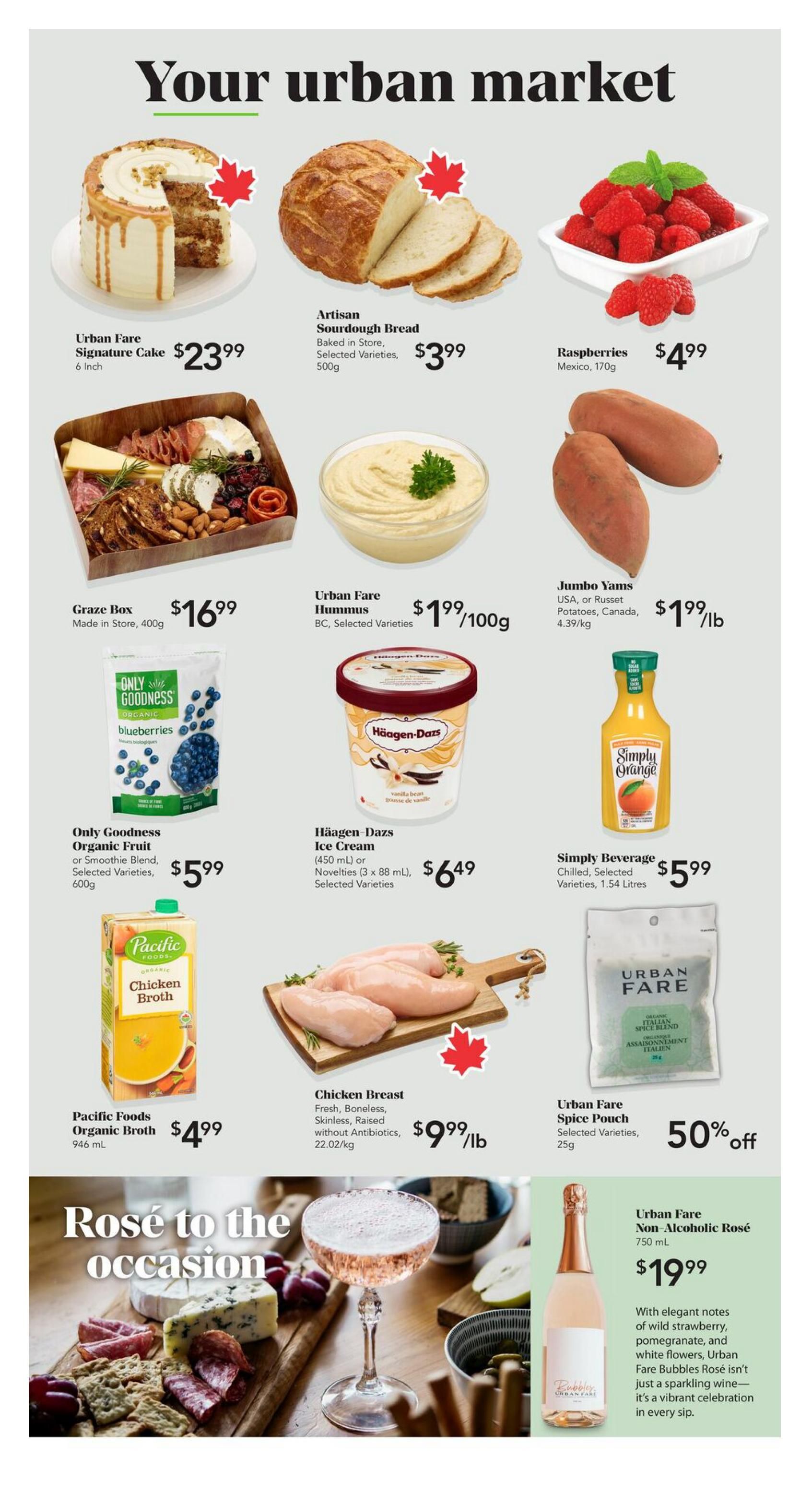 Urban Fare weekly flyer specials page 2. Featuring a 6-inch Urban Fare Signature Cake for $23.99, Artisan Sourdough Bread baked in-store for $3.99, and 170g of Raspberries from Mexico for $4.99. Also available is a Graze Box made in-store for $16.99, Urban Fare Hummus in BC, selected varieties for $1.99/100g, and Jumbo Yams (USA or Russet Potatoes, Canada) for $1.99/lb. Other deals include Only Goodness Organic Fruit or Smoothie Blend, selected varieties, 600g for $5.99, Häagen-Dazs Ice Cream (450 ml or Novelties 3 x 88 ml), selected varieties for $6.49, and Simply Beverage, chilled, selected varieties, 1.54 Litres for $5.99. Pacific Foods Organic Broth, 946 mL, is priced at $4.99. Fresh, boneless, skinless, raised without antibiotics Chicken Breast is $9.99/lb. Urban Fare Spice Pouch, selected varieties, 25g, is 50% off. The page also highlights Rosé to the occasion with Urban Fare Non-Alcoholic Rosé, 750 mL, for $19.99, described as having elegant notes of wild strawberry, pomegranate, and white flowers.
