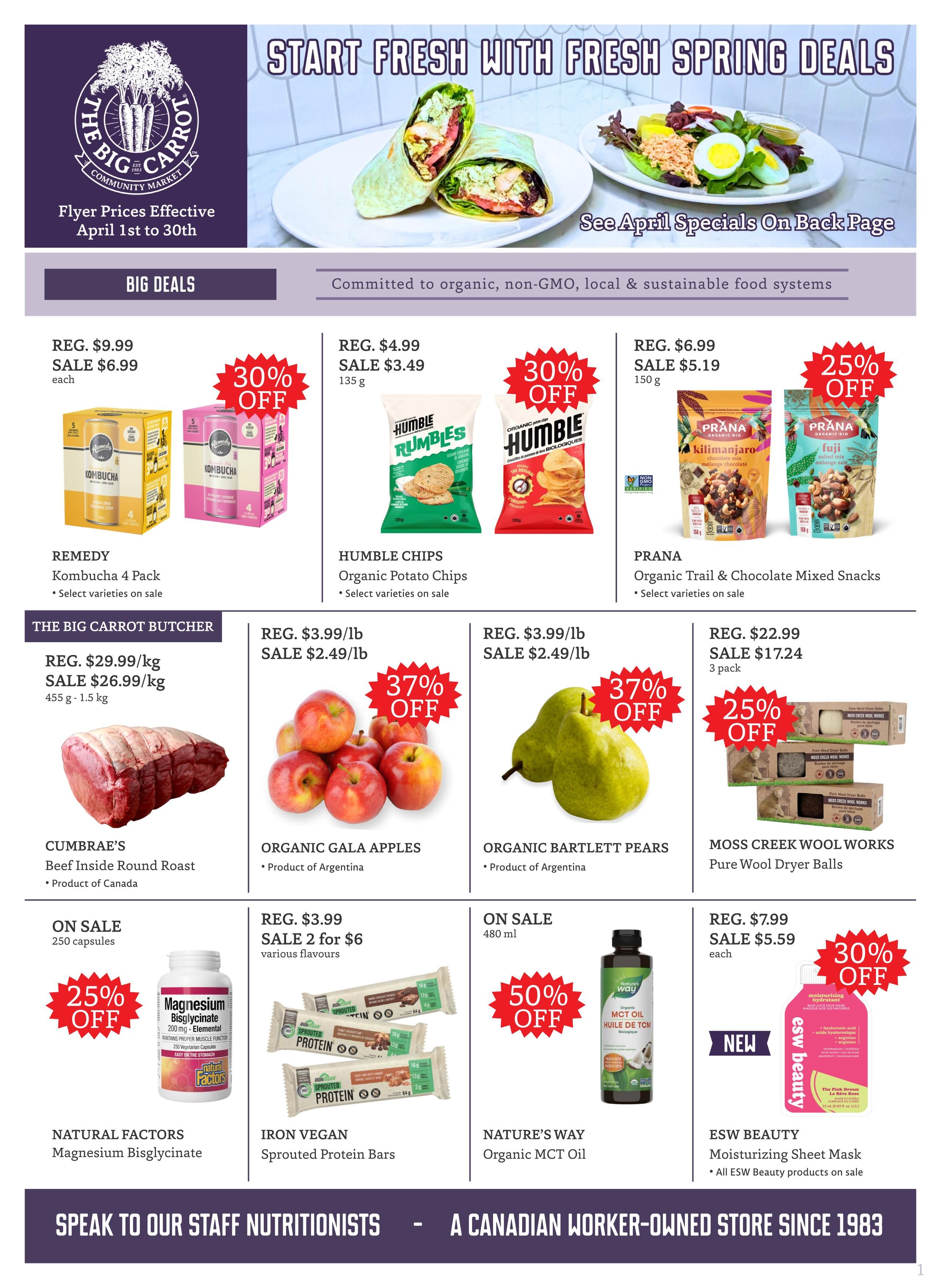 The Big Carrot flyer page 1 features 'Start Fresh With Spring Deals'. Big Deals include Remedy Kombucha 4 Pack on sale for $6.99 (30% off), Humble Chips Organic Potato Chips on sale for $3.49 (30% off), and Prana Organic Trail & Chocolate Mixed Snacks on sale for $5.19 (25% off). The Big Carrot Butcher section offers Beef Inside Round Roast from Cumbrae's on sale for $26.99/kg. Produce deals include Organic Gala Apples on sale for $2.49/lb (37% off) and Organic Bartlett Pears on sale for $2.49/lb (37% off). Other specials are Natural Factors Magnesium Bisglycinate on sale for 25% off, Iron Vegan Sprouted Protein Bars on sale 2 for $6, Nature's Way Organic MCT Oil on sale for $5.59 (30% off), and Moss Creek Wool Works Pure Wool Dryer Balls on sale for $17.24 (25% off). ESW Beauty Moisturizing Sheet Mask is also featured as new and on sale. Flyer prices are effective April 1st to 30th.