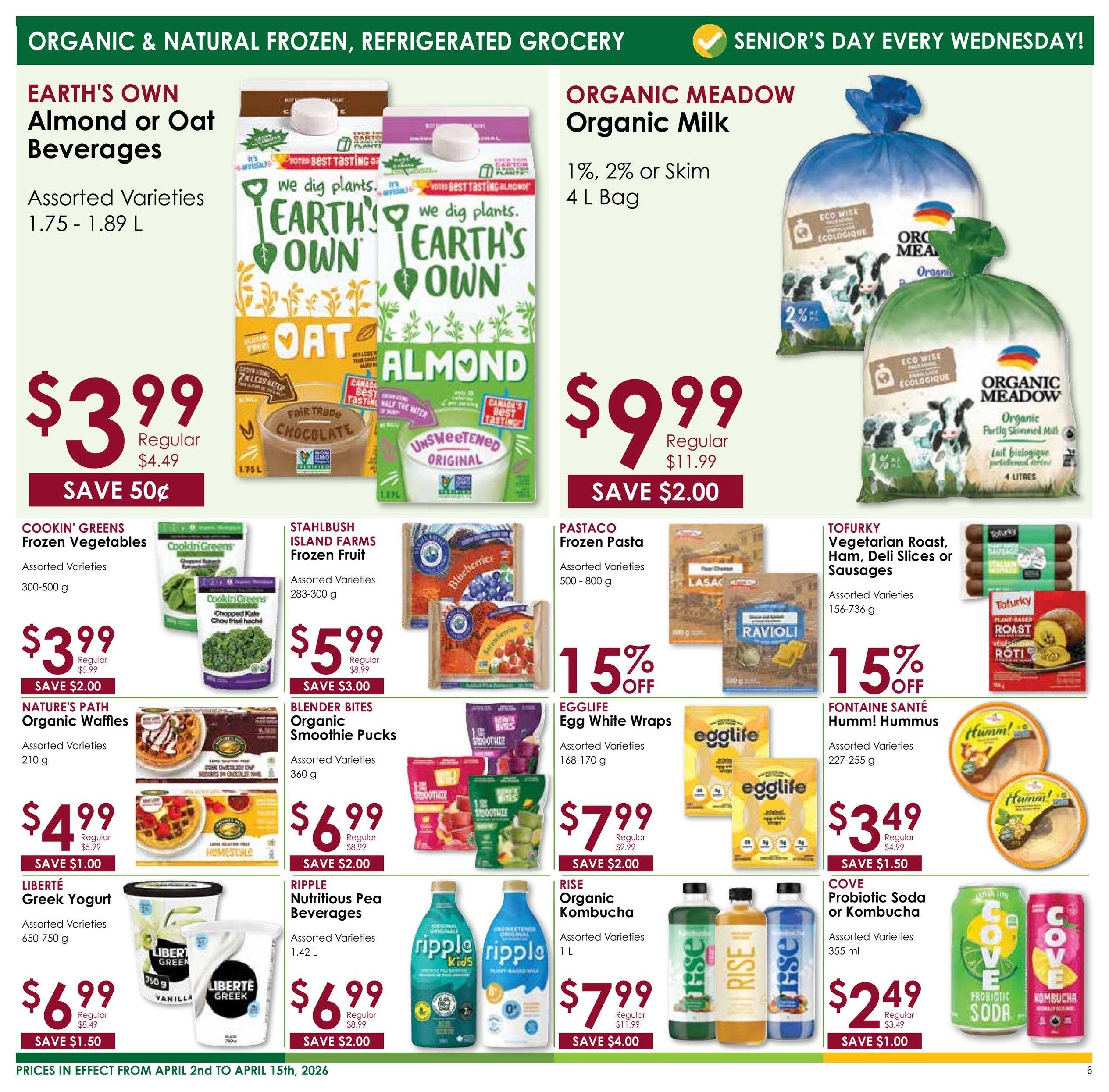 Nature's Emporium flyer specials page 6 features organic and natural frozen and refrigerated grocery items. Earth's Own Almond or Oat Beverages (1.75-1.89 L) are on sale for $3.99, saving 50¢. Organic Meadow Organic Milk (1%, 2% or Skim, 4 L bag) is priced at $9.99, saving $2.00. Cookin' Greens Frozen Vegetables (300-500 g) are $3.99, saving $2.00. Stahlbush Island Farms Frozen Fruit (283-300 g) is $5.99, saving $3.00. Nature's Path Organic Waffles (210 g) are $4.99, saving $1.00. Blender Bites Organic Smoothie Pucks (360 g) are $6.99, saving $2.00. Liberté Greek Yogurt (650-750 g) is $6.99, saving $1.50. Ripple Nutritious Pea Beverages (1.42 L) are $6.99, saving $2.00. Pastaco Frozen Pasta (500-800 g) is 15% off. Egglife Egg White Wraps (168-170 g) are 15% off. Tofurky Vegetarian Roast, Ham, Deli Slices or Sausages (156-736 g) are 15% off. Fontaine Santé Humm! Hummus (227-255 g) is $3.49, saving $1.50. Rise Organic Kombucha (1 L) is $7.99, saving $4.00. Cove Probiotic Soda or Kombucha (355 ml) is $2.49, saving $1.00. Prices are in effect from April 2nd to April 15th, 2026. Senior's Day is every Wednesday.