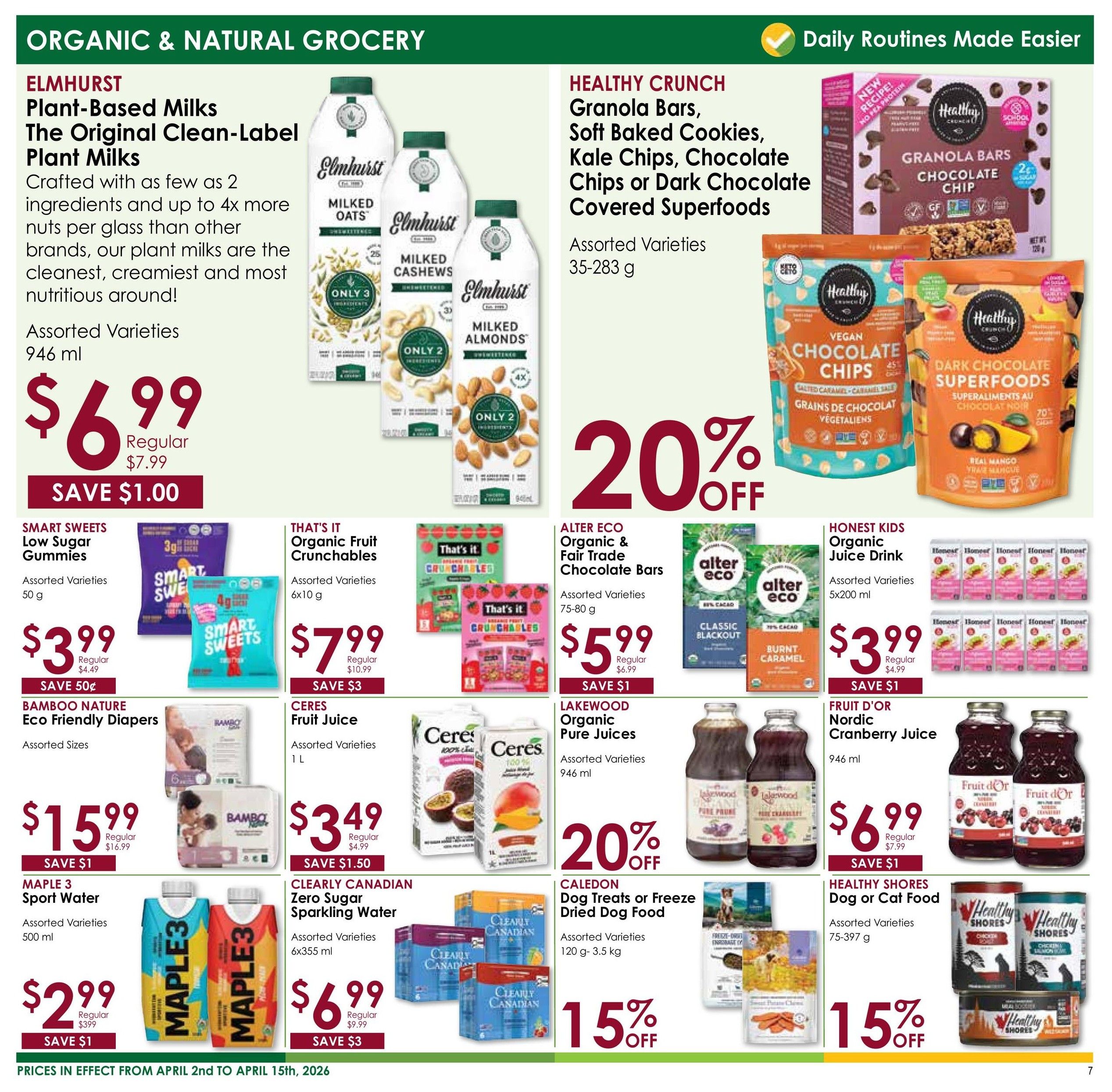 Nature's Emporium flyer page 7 features Organic & Natural Grocery specials. Elmhurst Plant-Based Milks, including Milked Oats, Milked Cashews, and Milked Almonds in 946 ml sizes, are on sale for $6.99, saving $1.00 off the regular price of $7.99. Healthy Crunch Granola Bars, Soft Baked Cookies, Kale Chips, Chocolate Chips, or Dark Chocolate Covered Superfoods in assorted varieties (35-283 g) are 20% off. Smart Sweets Low Sugar Gummies (50 g) are $3.99, saving 50 cents off the regular price of $4.49. That's It Organic Fruit Crunchables (6x10 g) are $7.99, saving $3 off the regular price of $10.99. Alter Eco Organic & Fair Trade Chocolate Bars (75-80 g) are $5.99, saving $1 off the regular price of $6.99. Honest Kids Organic Juice Drink (5x200 ml) is $3.99, saving $1 off the regular price of $4.99. Bamboo Nature Eco Friendly Diapers (assorted sizes) are $15.99, saving $1 off the regular price of $16.99. Ceres Fruit Juice (1 L) is $3.49, saving $1.50 off the regular price of $4.99. Lakewood Organic Pure Juices (946 ml) are 20% off. Fruit d'Or Nordic Cranberry Juice (946 ml) is $6.99, saving $1 off the regular price of $7.99. Maple 3 Sport Water (500 ml) is $2.99, saving $1 off the regular price of $3.99. Clearly Canadian Zero Sugar Sparkling Water (6x355 ml) is $6.99, saving $3 off the regular price of $9.99. Caledon Dog Treats or Freeze Dried Dog Food (120 g-3.5 kg) are 15% off. Healthy Shores Dog or Cat Food (75-397 g) is 15% off. Prices are in effect from April 2nd to April 15th, 2026.