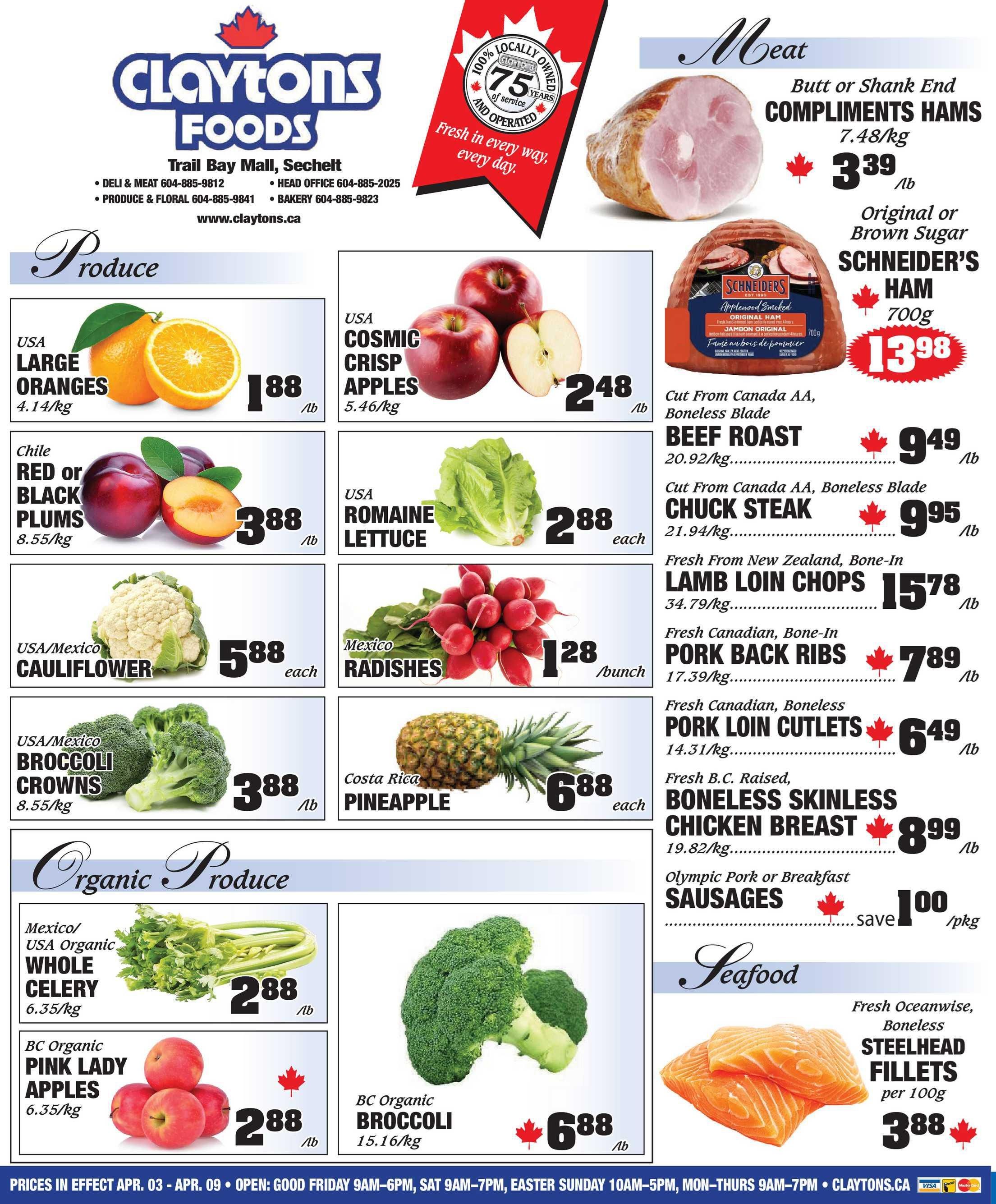 Claytons Foods flyer page 1 featuring weekly specials. Produce section includes USA Large Oranges for $1.88/lb, USA Cosmic Crisp Apples for $2.48/lb, Chile Red or Black Plums for $3.88/lb, USA Romaine Lettuce for $2.88 each, Mexico Radishes for $1.28/bunch, USA/Mexico Cauliflower for $5.88 each, USA/Mexico Broccoli Crowns for $3.88/lb, and Costa Rica Pineapple for $6.88 each. Organic Produce includes Mexico/USA Organic Whole Celery for $2.88/lb, BC Organic Pink Lady Apples for $2.88/lb, and BC Organic Broccoli for $6.88/lb. Meat section features Compliments Hams (Butt or Shank End) for $3.39/lb, Original or Brown Sugar Schneiders Ham (700g) for $13.98, Cut From Canada AA Boneless Blade Beef Roast for $9.49/lb, Cut From Canada AA Boneless Blade Chuck Steak for $9.95/lb, Fresh From New Zealand Bone-In Lamb Loin Chops for $15.78/lb, Fresh Canadian Bone-In Pork Back Ribs for $7.89/lb, Fresh Canadian Boneless Pork Loin Cutlets for $6.49/lb, and Fresh B.C. Raised Boneless Skinless Chicken Breast for $8.99/lb. Also featured are Olympic Pork or Breakfast Sausages with a save of $1.00/pkg. Seafood section includes Fresh Oceanwise Boneless Steelhead Fillets for $3.88 per 100g. Prices are in effect April 3 - April 9. Store hours are listed: Good Friday 9AM-6PM, Saturday 9AM-7PM, Easter Sunday 10AM-5PM, Monday-Thursday 9AM-7PM.