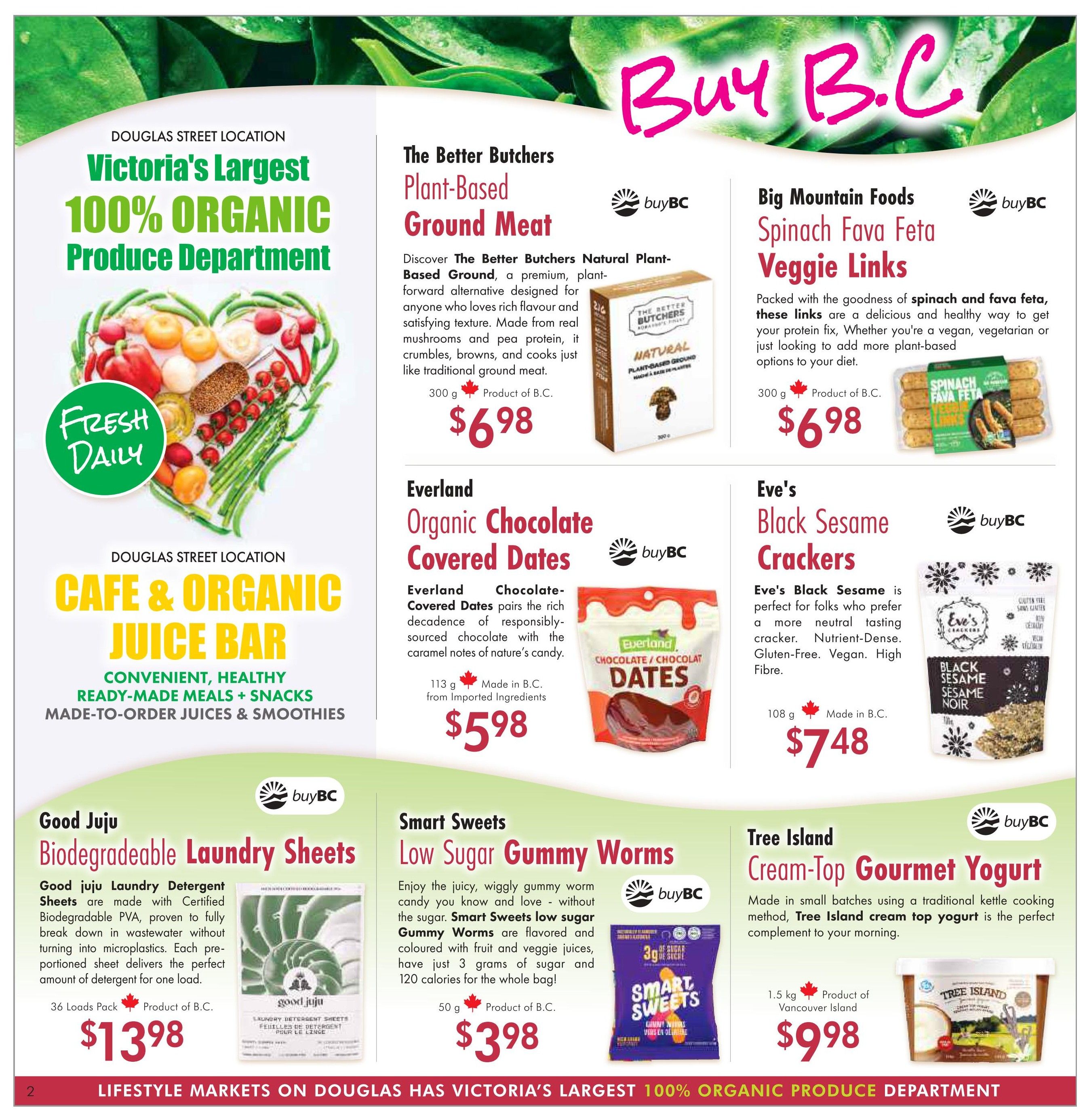 Lifestyle Markets flyer page 2 features 'Victoria's Largest 100% Organic Produce Department' and 'Cafe & Organic Juice Bar' at the Douglas Street Location. Featured products include The Better Butchers Plant-Based Ground Meat for $6.98, Big Mountain Foods Spinach Fava Feta Veggie Links for $6.98, Everland Organic Chocolate Covered Dates for $5.98, Eve's Black Sesame Crackers for $7.48, Good Juju Biodegradable Laundry Sheets (36 Loads Pack) for $13.98, Smart Sweets Low Sugar Gummy Worms (50 g) for $3.98, and Tree Island Cream-Top Gourmet Yogurt (1.5 kg) for $9.98. All featured products are indicated as 'Product of B.C.' or 'Made in B.C.', with some specifying 'from Imported Ingredients' or 'from Vancouver Island'.