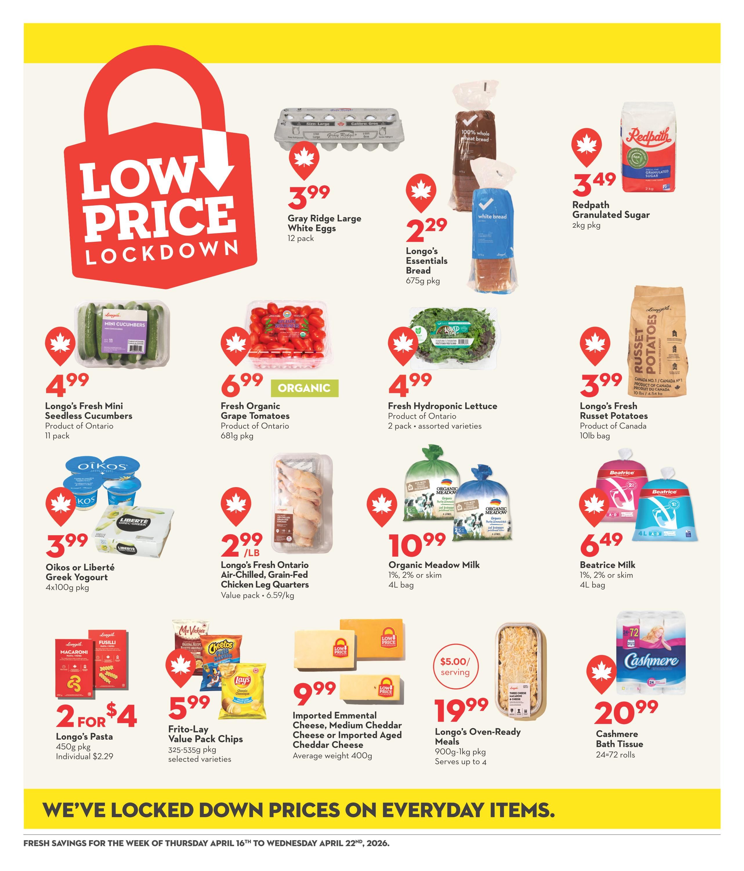 Garden Foods weekly flyer specials page 14 features a 'Low Price Lockdown' promotion. Featured items include Gray Ridge Large White Eggs for $3.99 (12 pack), Longo's Essentials Bread for $2.29 (675g pkg), and Redpath Granulated Sugar for $3.49 (2kg pkg). Also available are Longo's Fresh Mini Seedless Cucumbers for $4.99 (11 pack), Organic Fresh Grape Tomatoes for $6.99 (681g pkg), and Fresh Hydroponic Lettuce for $4.99 (2 pack, assorted varieties). Dairy and protein options include Oikos or Liberté Greek Yogurt for $3.99 (4x100g pkg), Longo's Fresh Ontario Air-Chilled, Grain-Fed Chicken Leg Quarters for $2.99/lb (value pack, 6.59/kg), Organic Meadow Milk (1%, 2% or skim) for $10.99 (4L bag), and Beatrice Milk (1%, 2% or skim) for $6.49 (4L bag). Pantry and convenience items include Longo's Pasta for 2 for $4 (450g pkg, individual $2.29), Frito-Lay Value Pack Chips for $5.99 (325-535g pkg, selected varieties), Imported Emmental Cheese, Medium Cheddar Cheese or Imported Aged Cheddar Cheese for $9.99 (average weight 400g), Longo's Oven-Ready Meals for $19.99 (900g-1kg pkg, serves up to 4), and Cashmere Bath Tissue for $20.99 (24=72 rolls). The flyer highlights 'We've Locked Down Prices on Everyday Items' for the week of April 16th to April 22nd, 2026.