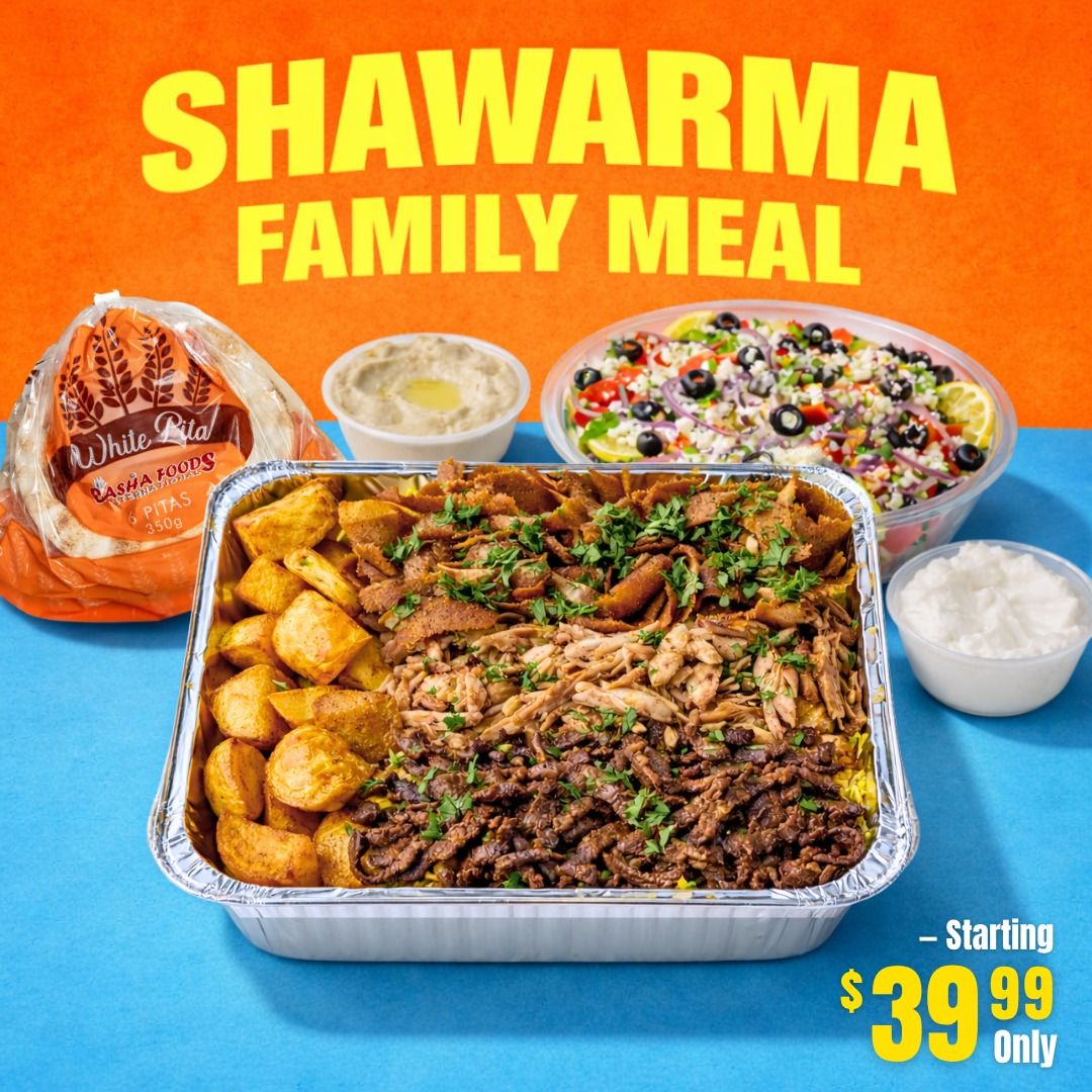 Basha Foods International weekly flyer specials page 10 features a Shawarma Family Meal deal. The meal includes a large platter of shawarma meat (beef and chicken) served over rice, with a side of roasted potatoes, a container of hummus, a side salad with tomatoes, olives, and lemon, and a container of garlic sauce. A bag of Basha Foods White Pita bread (6 pitas, 350g) is also shown. The Shawarma Family Meal is available starting at $39.99.