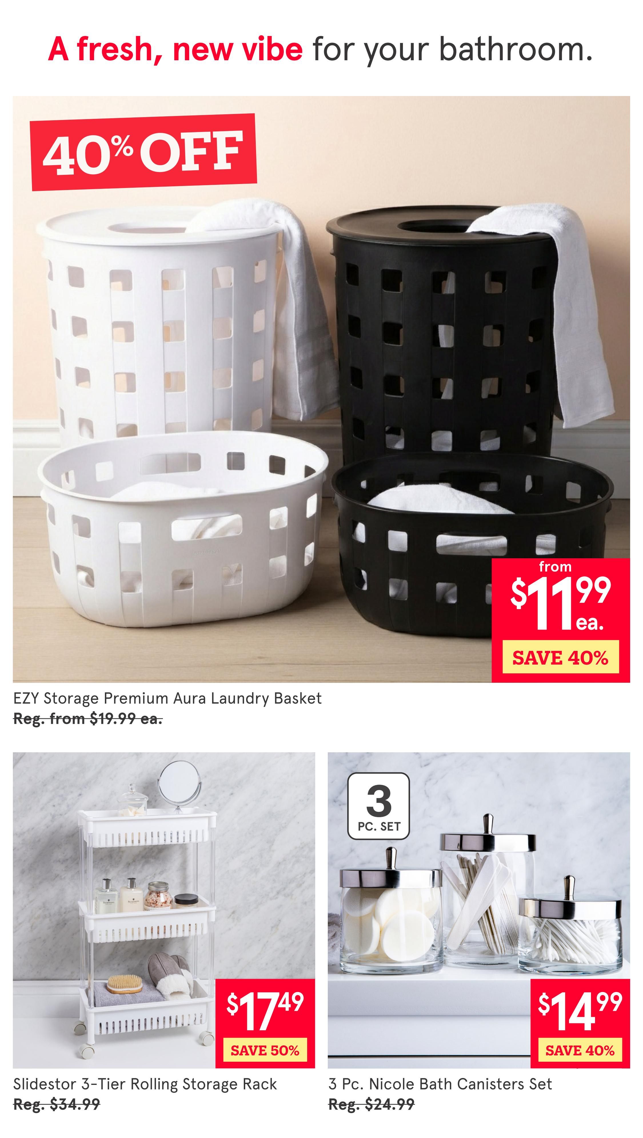 Kitchen Stuff Plus weekly flyer specials page 3 features bathroom organization items. Get the EZY Storage Premium Aura Laundry Basket for $11.99 each, saving 40% off the regular price of $19.99. Also available is the Slidestor 3-Tier Rolling Storage Rack for $17.49, a 50% savings from the regular price of $34.99. Additionally, the 3 Pc. Nicole Bath Canisters Set is on sale for $14.99, with a 40% discount from the regular price of $24.99. The page headline reads 'A fresh, new vibe for your bathroom.'