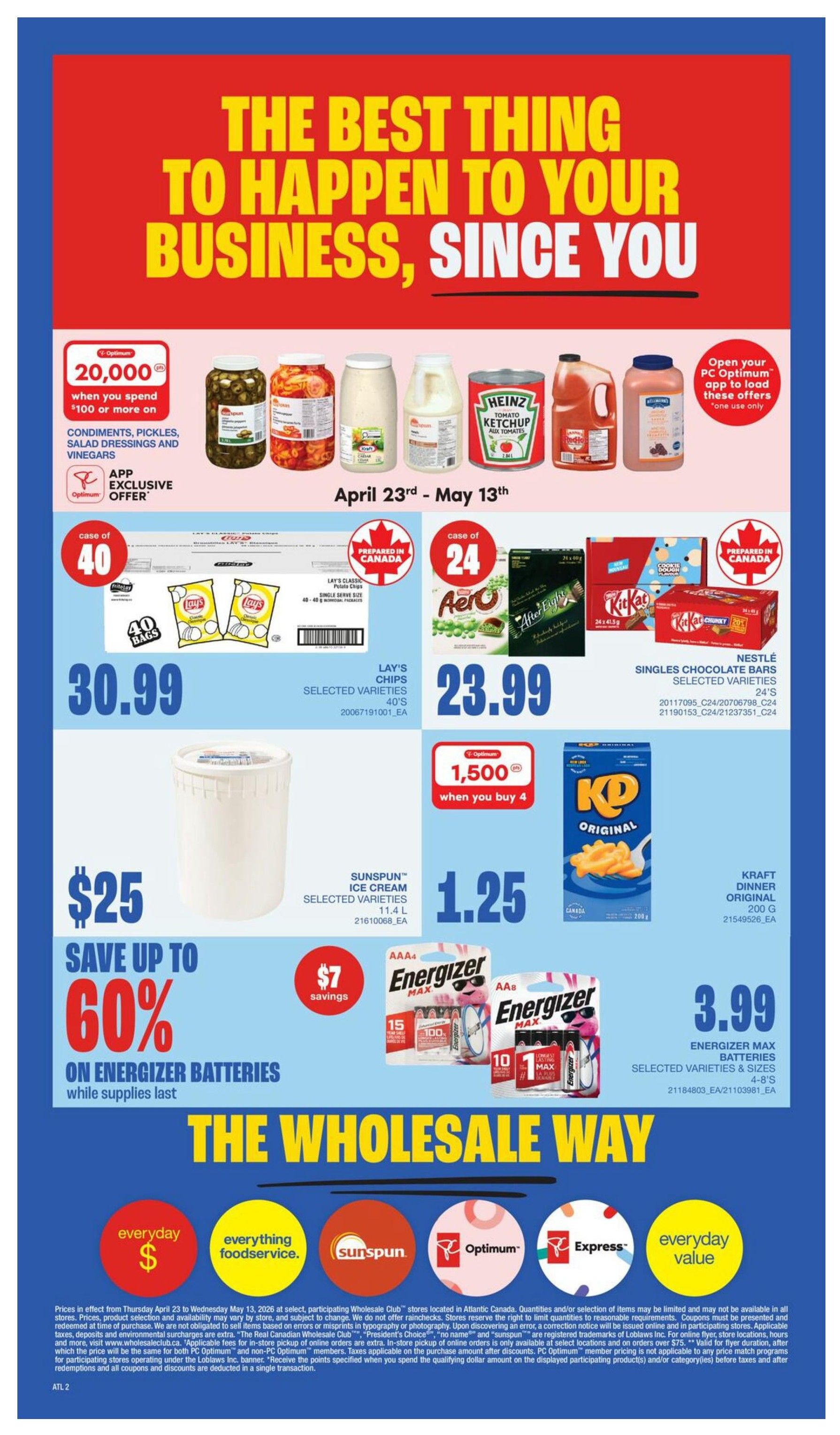 Wholesale Club Atlantic Canada flyer specials page 4. Features an app exclusive offer for 20,000 PC Optimum points when you spend $100 or more on condiments, pickles, salad dressings, and vinegars. Also on sale: Lay's Chips, selected varieties, 40 bags for $30.99; Aero or Kit Kat bars, selected varieties, 24 count for $23.99; Sunspun Ice Cream, selected varieties, 11.4 L for $25; Kraft Dinner Original, 200 g for $1.25. Save up to 60% on Energizer Max Batteries, selected varieties and sizes, with $7 savings. The bottom of the page highlights 'The Wholesale Way' with icons for everyday savings, everything foodservice, Sunspun, Optimum, Express, and everyday value.