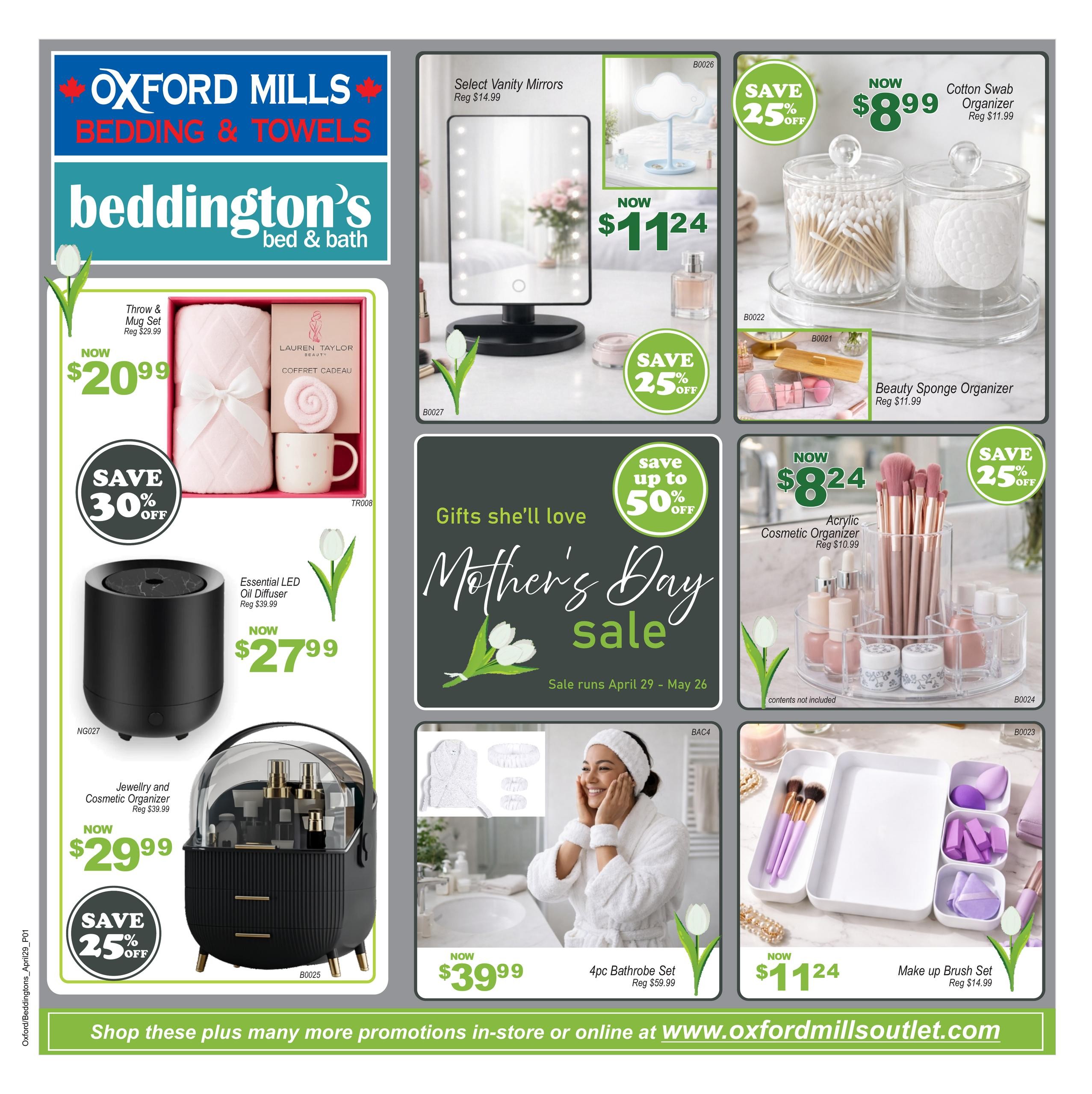 Beddington's Bed & Bath flyer page featuring a Mother's Day sale from April 29 to May 26. Featured items include a Throw & Mug Set for $20.99 (save 30% off), an Essential LED Oil Diffuser for $27.99, and a Jewellery and Cosmetic Organizer for $29.99 (save 25% off). Also available are Select Vanity Mirrors for $11.24 (save 25% off), a Cotton Swab Organizer for $8.99 (reg $11.99), a Beauty Sponge Organizer for $11.99, an Acrylic Cosmetic Organizer for $8.24 (reg $10.99), a 4pc Bathrobe Set for $39.99 (reg $59.99), and a Make up Brush Set for $11.24 (reg $14.99). The flyer also highlights a Mother's Day sale with savings up to 50% off. Visit www.oxfordmillsoutlet.com for more promotions.