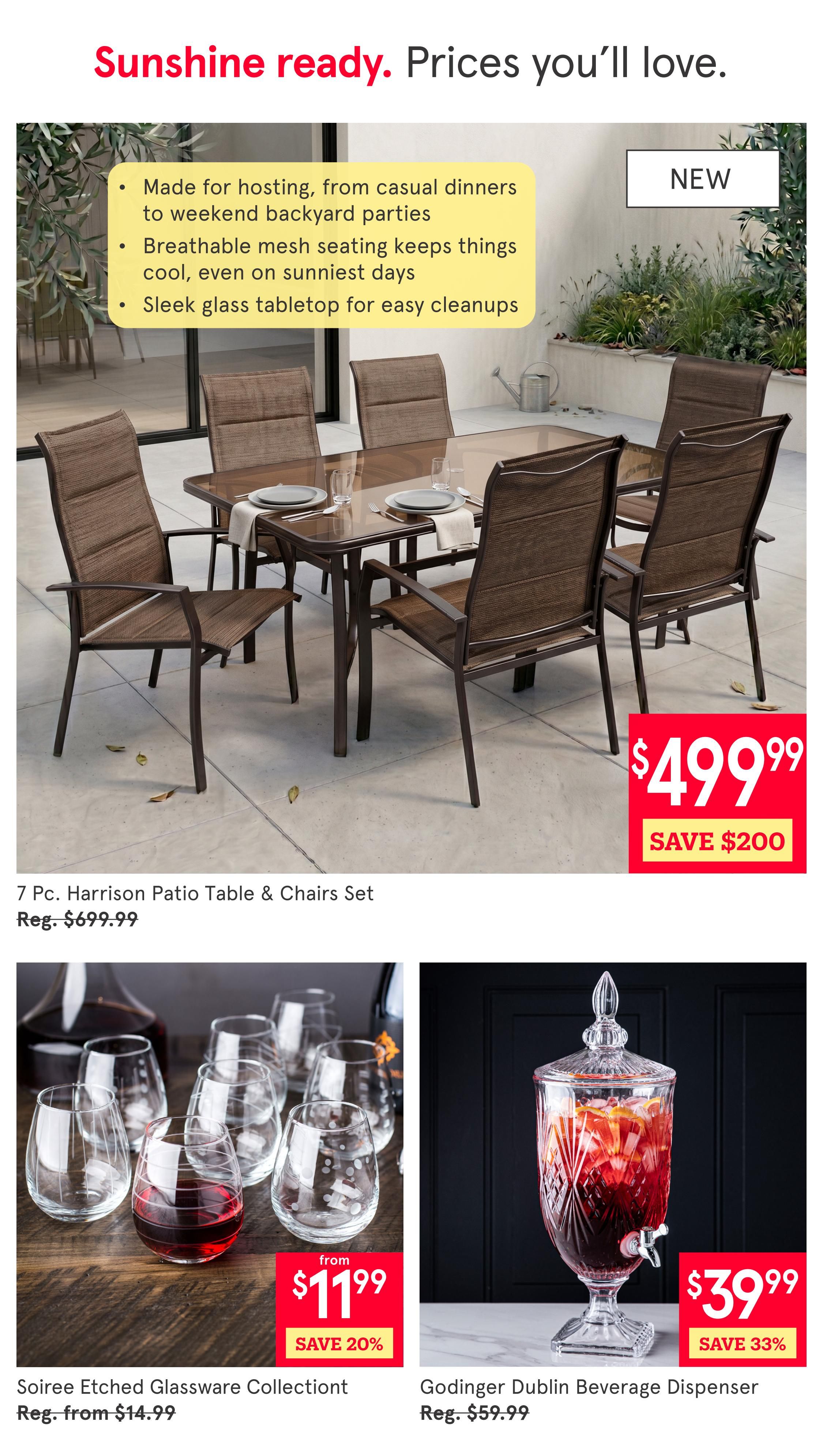 Kitchen Stuff Plus flyer page 3 features a 'Sunshine ready. Prices you'll love.' theme. The main item is the 7 Pc. Harrison Patio Table & Chairs Set, marked as NEW, on sale for $499.99, a saving of $200 from its regular price of $699.99. This set is described as made for hosting, with breathable mesh seating and a sleek glass tabletop for easy cleanups. Below, the Soiree Etched Glassware Collection is available from $11.99, with a 20% saving from its regular price starting at $14.99. To the right, the Godinger Dublin Beverage Dispenser is on sale for $39.99, a 33% saving from its regular price of $59.99.
