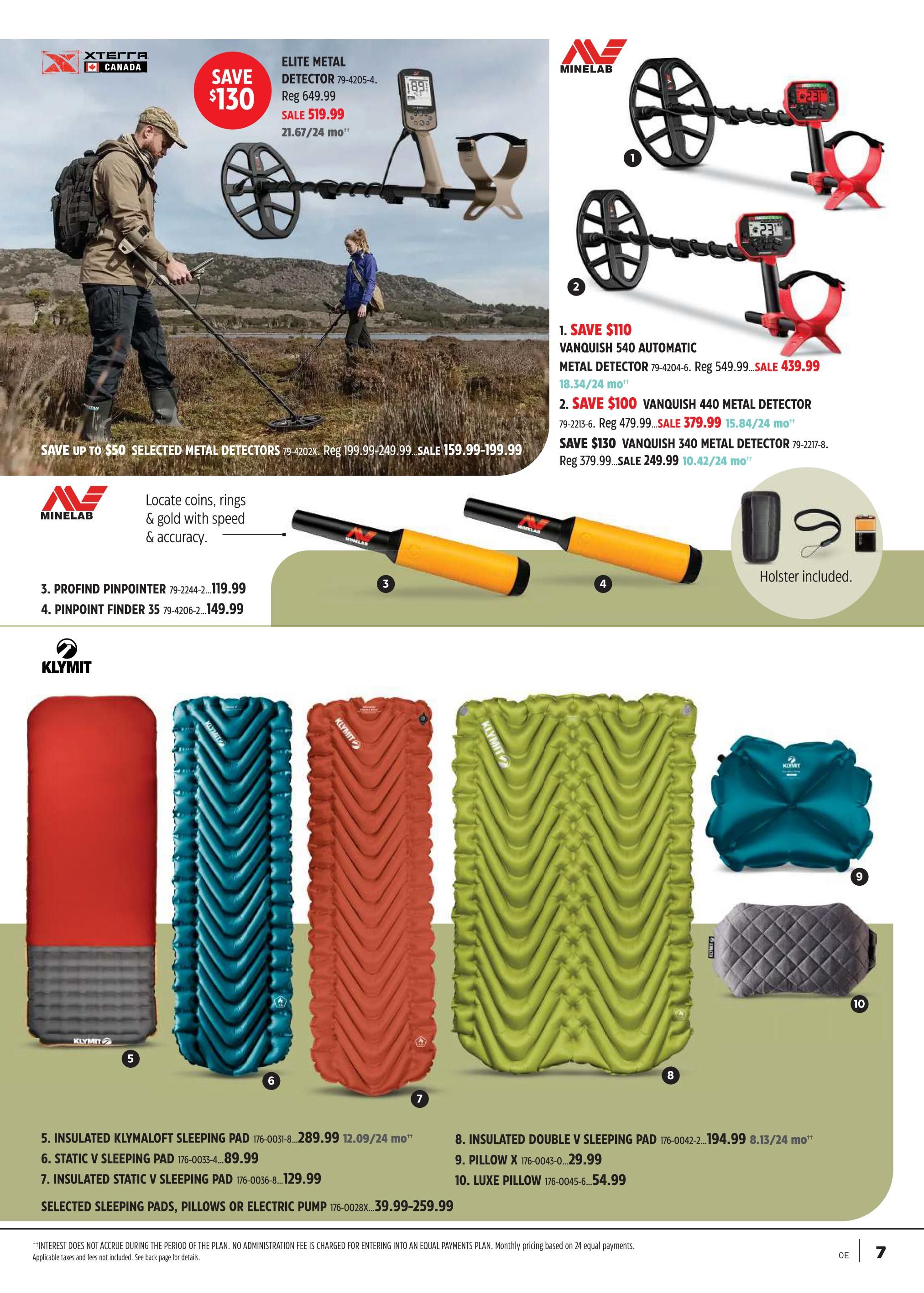 Canadian Tire flyer page 6 features metal detectors and sleeping pads. A large graphic shows a man and a woman using metal detectors outdoors, with a 'SAVE $130' offer on an Elite Metal Detector, now on sale for $519.99, originally $649.99. Below, MineLab metal detectors are featured: Vanquish 540 Automatic for $439.99 (save $110), Vanquish 440 for $379.99 (save $100), and Vanquish 340 for $249.99 (save $130). Also available are the ProfiFind Pinpointer for $119.99 and the Pinpoint Finder 35 for $149.99. The bottom section showcases Klymit sleeping pads: Insulated Klymaloft Sleeping Pad for $289.99, Static V Sleeping Pad for $89.99, and Insulated Static V Sleeping Pad for $129.99. Additionally, an Insulated Double V Sleeping Pad is priced at $194.99, a Pillow X at $29.99, and a Luxe Pillow at $54.99. A general offer for selected sleeping pads, pillows, or electric pumps is $39.99-$259.99.