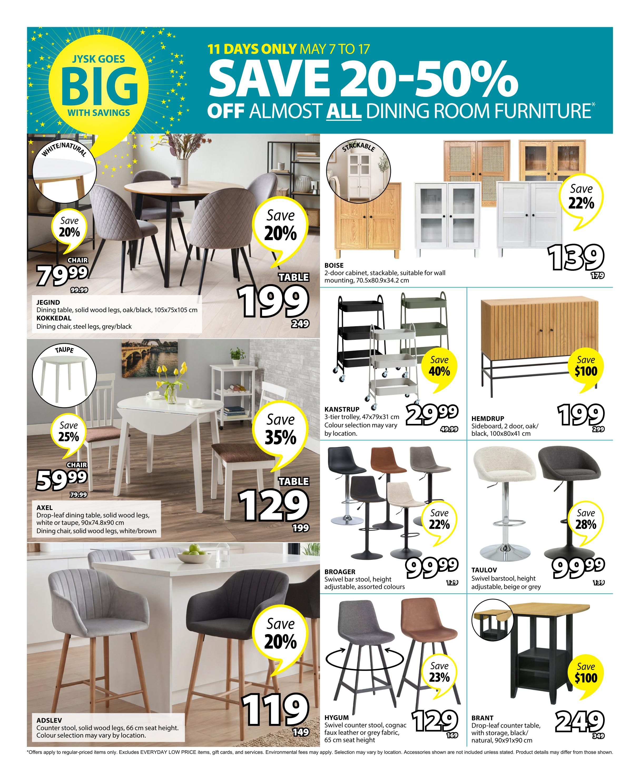 Jysk flyer page 14 features savings of 20-50% on dining room furniture. Highlights include the JEGIND dining table in oak/black for $79.99 (save 20%), with KOKKEDAL dining chairs in grey/black for $199. The AXEL drop-leaf dining table in white or taupe is $59.99 (save 25%), with dining chairs in white/brown for $129 (save 35%). Storage options include the BOISE 2-door stackable cabinet for $139 (save 22%), and the HEMDRUP 2-door side board in oak/black for $199 (save $100). KANSTRUP 3-tier trolleys are $29.99 (save 40%). Seating includes BROAGER swivel bar stools for $99.99 (save 22%), TAULOV swivel bar stools for $99.99 (save 28%), HYGUM swivel counter stools in cognac faux leather for $129 (save 23%), and ADSLEV counter stools for $119 (save 20%). The BRANT drop-leaf counter table with storage in black/natural is $249 (save $100).