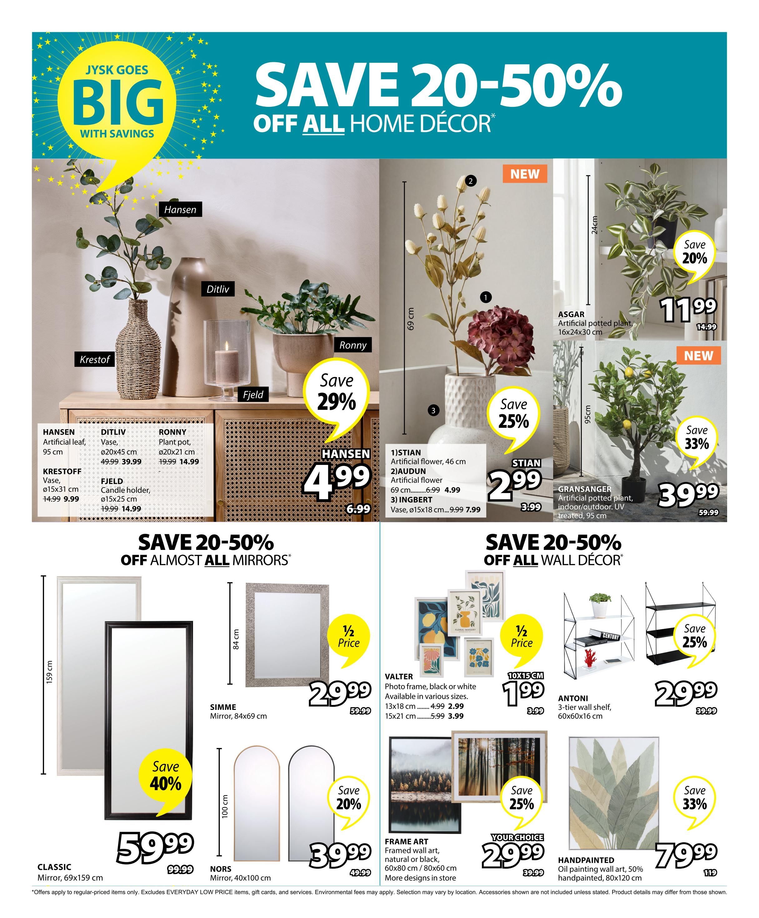 Jysk flyer page 26 features 'Save 20-50% Off All Home Decor'. Featured items include Hansen artificial leaf for $4.99 (was $6.99), Ditliv vase for $39.99, Ronny plant pot for $14.99 (was $19.99), Krestoff vase for $9.99 (was $14.99), and Fjeld candle holder for $14.99 (was $19.99). Also on sale are Stian artificial flowers starting at $2.99 (was $3.99) and a large artificial potted plant for $11.99 (was $14.99), with another artificial potted plant at $39.99 (was $59.99) and 33% off. The page also highlights 'Save 20-50% Off Almost All Mirrors' with a Classic mirror for $59.99 (was $99.99) and 40% off, and Nors mirrors for $39.99 (was $49.99) with 20% off. Wall decor includes Valter photo frames at $1.99 (was $3.99) for 10x15 cm sizes, Antoni 3-tier wall shelf for $29.99 (was $39.99) with 25% off, and Handpainted oil painting wall art for $79.99 (was $119) with 33% off. Frame art is available for $29.99 (was $39.99) with 25% off.