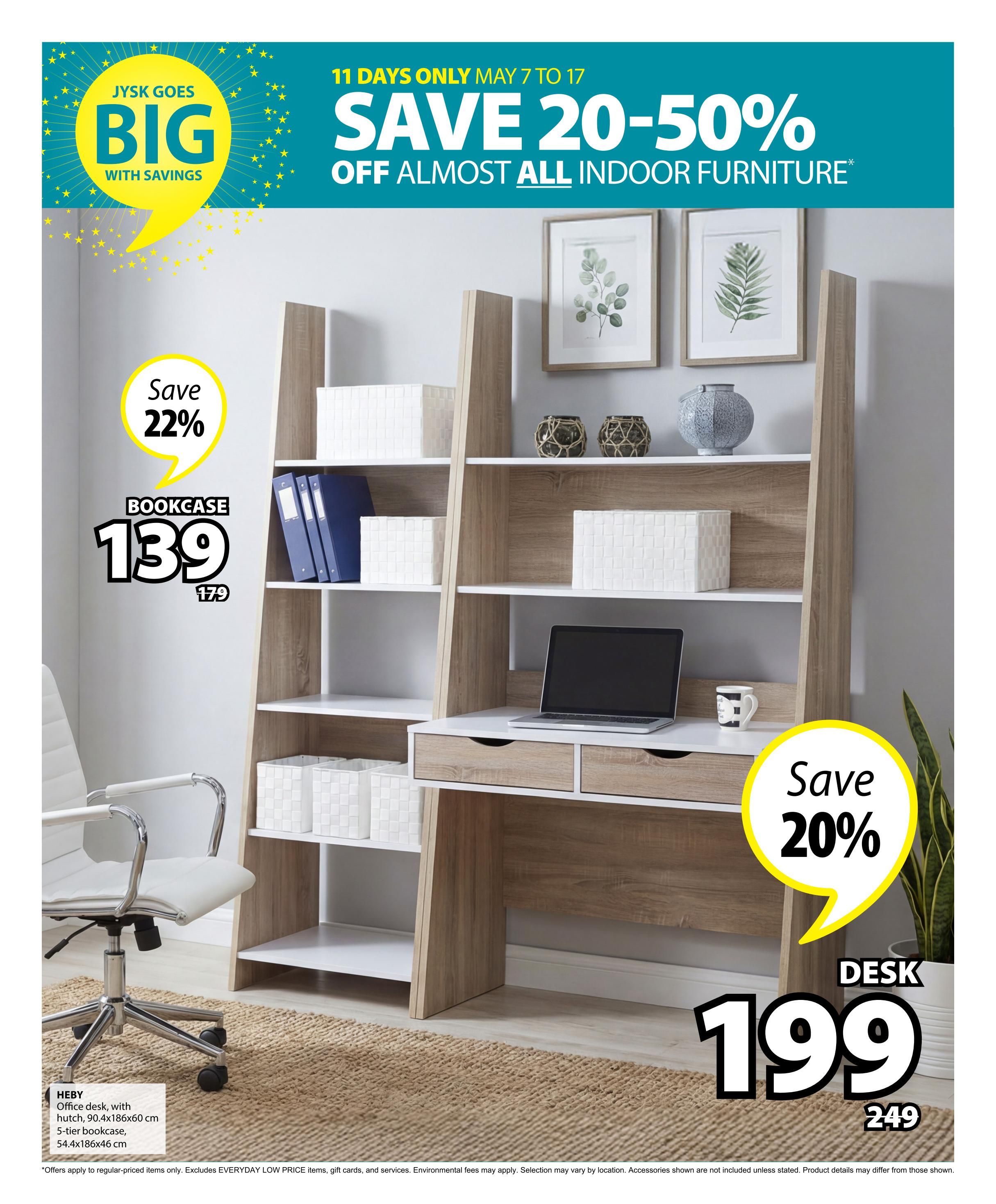Jysk flyer, page 32. Save 20-50% off almost all indoor furniture from May 7 to 17. Featured items include the HEBY bookcase with hutch, originally $179, now on sale for $139, saving 22%. Also featured is a desk on sale for $199, down from $249, a 20% saving. The desk is shown with a laptop and mug. The bookcase is shown with decorative boxes and binders. An office chair is also visible.