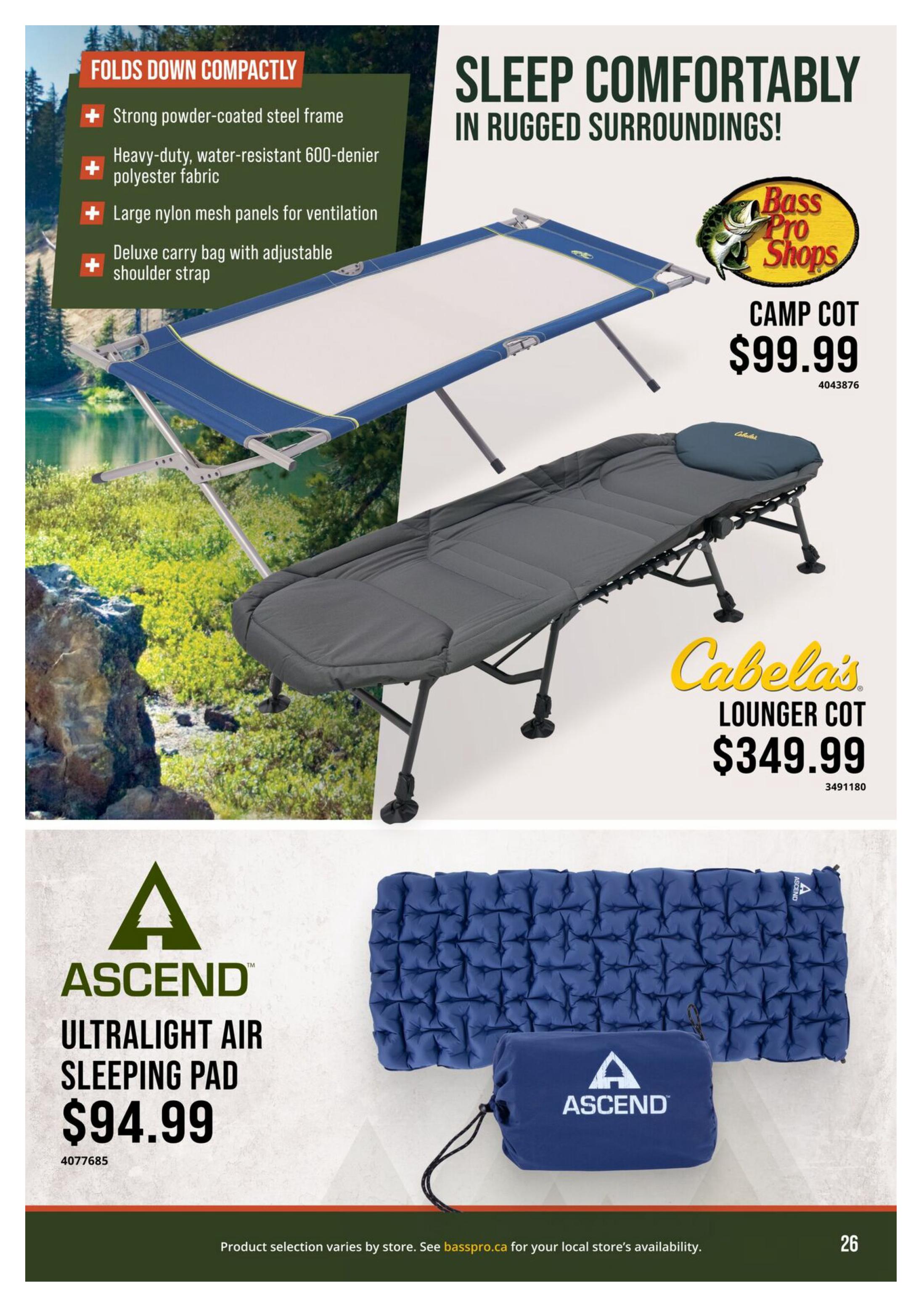 Cabela's flyer page 26 features camping comfort with three products. A Bass Pro Shops Camp Cot is priced at $99.99. It features a strong powder-coated steel frame, heavy-duty water-resistant 600-denier polyester fabric, large nylon mesh panels for ventilation, and includes a deluxe carry bag with an adjustable shoulder strap. Also shown is the Cabela's Lounger Cot for $349.99. Below, the Ascend Ultralight Air Sleeping Pad is available for $94.99, shown inflated and packed in its carry bag.