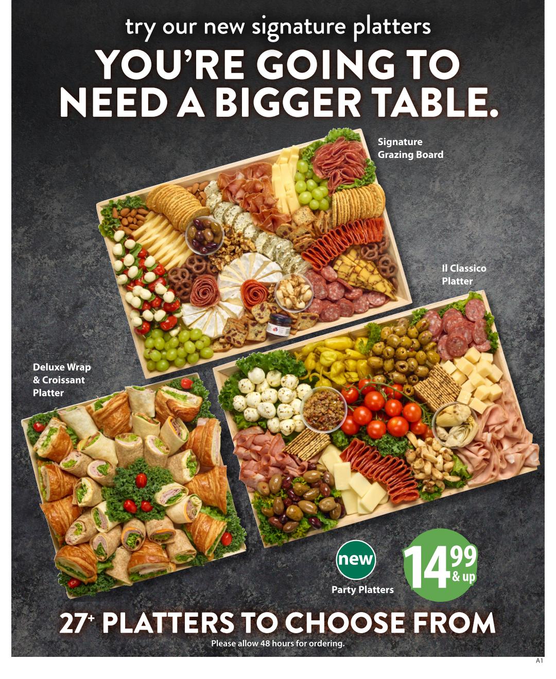 Save-On-Foods flyer page featuring a variety of new signature platters. The page highlights the 'YOU'RE GOING TO NEED A BIGGER TABLE' slogan. Featured platters include the Signature Grazing Board, Il Classico Platter, and Deluxe Wrap & Croissant Platter. A new Party Platters option is available starting at $14.99 & up. There are over 27 platters to choose from, and customers are advised to allow 48 hours for ordering.