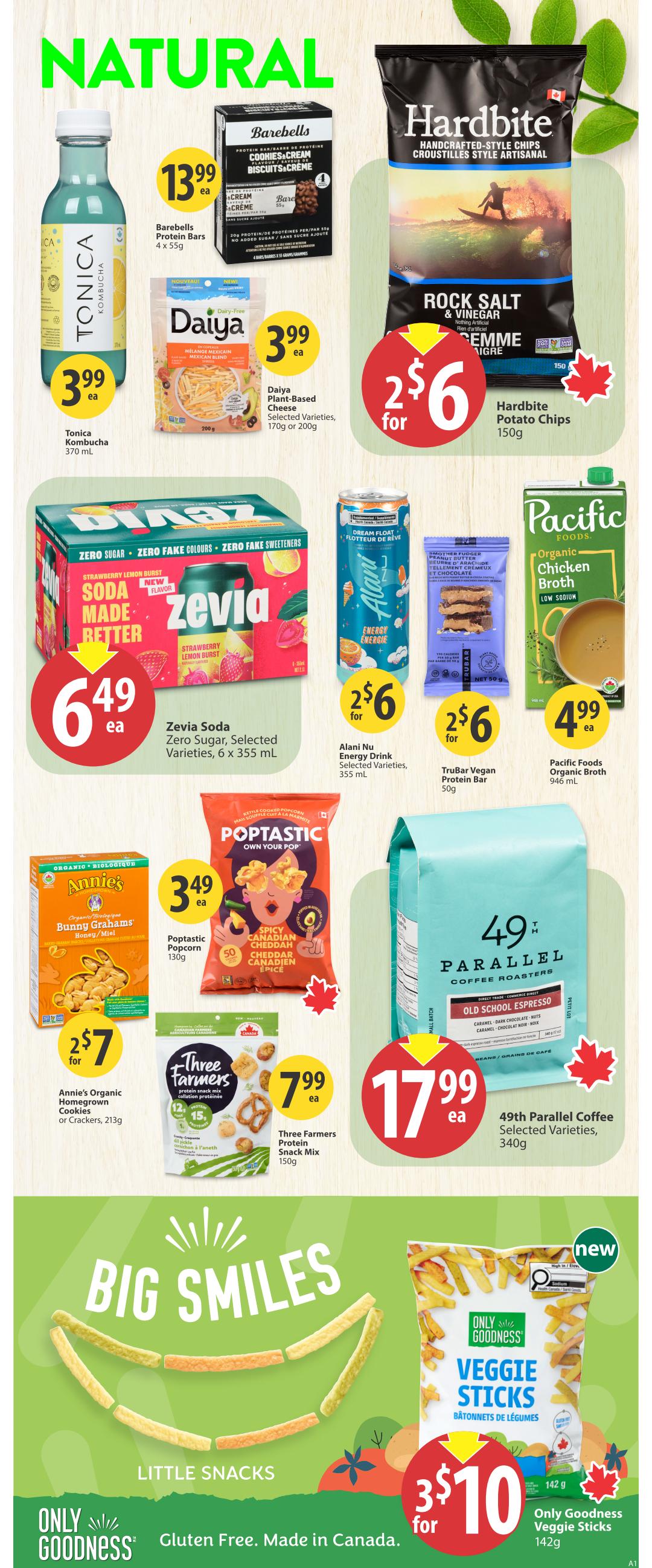 Save-On-Foods weekly flyer specials page 28 features natural and snack items. Featured products include Tonica Kombucha for $3.99, Barebells Protein Bars 4 x 55g for $13.99, Daiya Plant-Based Cheese (selected varieties, 170g or 200g) for $3.99, and Hardbite Potato Chips (Rock Salt & Vinegar, 150g) for 2 for $6. Also available are Zevia Soda (zero sugar, selected varieties, 6 x 355 mL) for $6.49, Alani Nu Energy Drink (selected varieties, 355 mL) for 2 for $6, and TruBar Vegan Protein Bar (50g) for 2 for $6. Pacific Foods Organic Chicken Broth (low sodium, 946 mL) is $4.99. Annie's Organic Homegrown Bunny Grahams (Honey/Miel) are $3.49, and Annie's Organic Homegrown Cookies or Crackers (213g) are 2 for $7. Poptastic Popcorn (Spicy Canadian Cheddar, 130g) is $3.49. Three Farmers Protein Snack Mix (150g) is $7.99. 49th Parallel Coffee (Old School Espresso, selected varieties, 340g) is $17.99. The 'Big Smiles' section highlights Only Goodness Veggie Sticks (gluten-free, made in Canada, 142g) for 3 for $10.