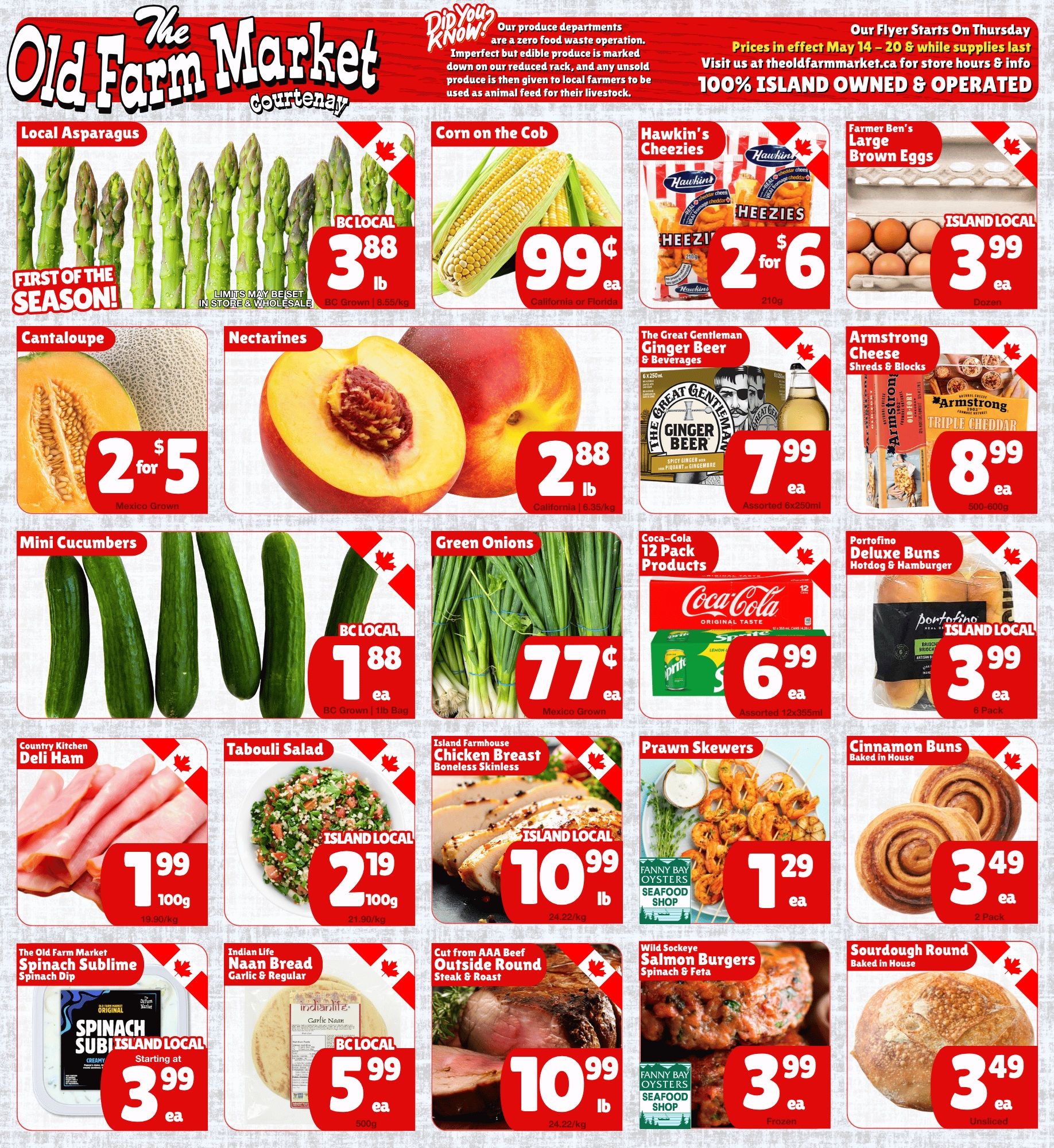 The Old Farm Market flyer featuring weekly specials valid May 14 to 20. The flyer promotes a zero food waste operation, ensuring imperfect but edible produce is marked down, and any unsold produce is given to local farmers for animal feed. Prices are in effect from May 14 to 20, and the market is 100% Island owned and operated. Featured deals include BC Local First of the Season Asparagus for $3.88 per lb. Corn on the Cob is 99 cents each. Hawkin's Cheezies (210g) are 2 for $6. Farmer Ben's Large Brown Eggs, Island Local, are $3.99 per dozen. Cantaloupe (Mexico Grown) is 2 for $5. Nectarines (California) are $2.88 per lb. The Great Gentleman Ginger Beer & Beverages (assorted 6x250ml) are $7.99 each. Armstrong Cheese Shreds & Blocks (500-600g) are $8.99 each. BC Local Mini Cucumbers (1lb bag) are $1.88 each. Green Onions (Mexico Grown) are 77 cents each. Coca-Cola 12 Pack Products (assorted 12x355ml) are $6.99 each. Portofino Deluxe Hotdog & Hamburger Buns, Island Local (6 pack), are $3.99 each. Country Kitchen Deli Ham is $1.99 per 100g. Island Local Tabouli Salad is $2.19 per 100g. Island Farmhouse Boneless Skinless Chicken Breast, Island Local, is $10.99 per lb. Fanny Bay Oysters Seafood Shop Prawn Skewers are $1.29 each. Baked in House Cinnamon Buns (2 pack) are $3.49 each. The Old Farm Market Spinach Sublime Spinach Dip, Island Local, starts at $3.99 each. Indian Life Garlic & Regular Naan Bread (500g), BC Local, is $5.99 each. Cut from AAA Beef Outside Round Steak & Roast is $10.99 per lb. Wild Sockeye Salmon Burgers with Spinach & Feta (frozen), from Fanny Bay Oysters Seafood Shop, are $3.99 each. Baked in House Sourdough Round (unsliced) is $3.49 each.
