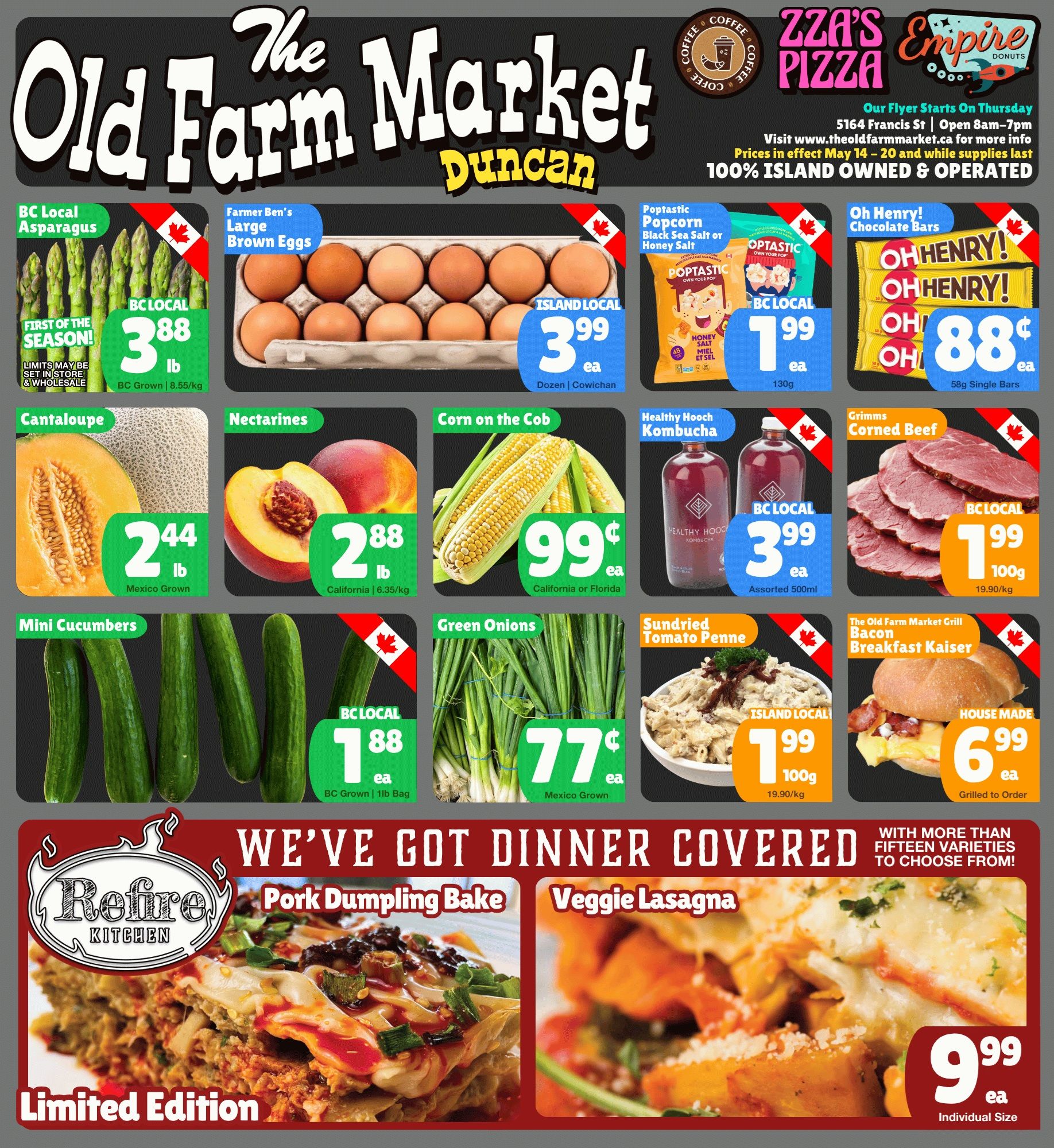 The Old Farm Market flyer features weekly specials. The top banner highlights Zza's Pizza and Empire Donuts, along with store information: 5164 Francis St, open 8am-7pm, and website www.theoldfarmmarket.ca. Prices are in effect May 14-20 and while supplies last. The market is 100% Island Owned & Operated. Featured produce includes BC Local Asparagus, first of the season, for $3.88 per lb. Farmer Ben's Large Brown Eggs, Island Local from Cowichan, are $3.99 per dozen. Poptastic Popcorn in Black Sea Salt or Honey Salt flavours is BC Local for $1.99 each (130g). Oh Henry! Chocolate Bars are 88 cents each for 58g single bars. Cantaloupe from Mexico is $2.44 per lb. Nectarines from California are $2.88 per lb. Corn on the Cob from California or Florida is 99 cents each. Healthy Hooch Kombucha, BC Local assorted 500ml, is $3.99 each. Grimms Corned Beef, BC Local, is $1.99 per 100g. Mini Cucumbers, BC Local 1lb bag, are $1.88 each. Green Onions from Mexico are 77 cents each. Sundried Tomato Penne, Island Local, is $1.99 per 100g. The Old Farm Market Grill offers a House Made Bacon Breakfast Kaiser, grilled to order, for $6.99 each. The 'We've Got Dinner Covered' section features Refire Kitchen Limited Edition Pork Dumpling Bake and Veggie Lasagna, both individual size, for $9.99 each, with more than fifteen varieties to choose from.