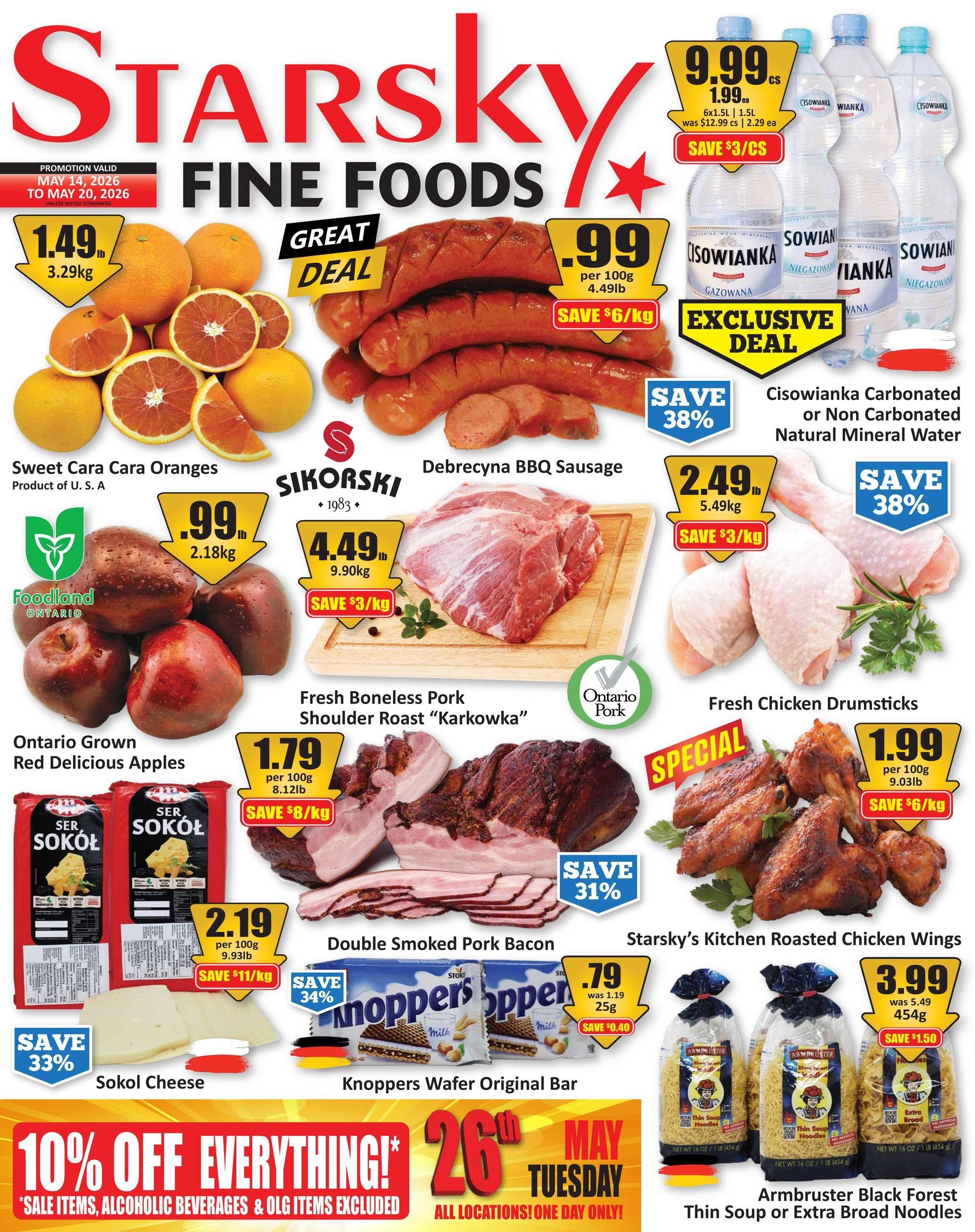 Starsky Fine Foods weekly flyer specials, valid May 14 to May 20, 2026. Featured items include Sweet Cara Oranges for $1.49/lb (3.29kg), Debrecyna BBQ Sausage for $.99 per 100g (4.49lb) with a save $6/kg discount, and Cisowianka Carbonated or Non Carbonated Natural Mineral Water for $9.99 per case, save $3/case. Also available are Ontario Grown Red Delicious Apples for $.99/lb (2.18kg), Fresh Boneless Pork Shoulder Roast 'Karkowka' for $4.49/lb (9.90kg) with a save $3/kg discount, and Fresh Chicken Drumsticks for $2.49/lb (5.49kg) with a save $3/kg discount. Other deals include Sokol Cheese for $2.19 per 100g (9.93lb) with a save $11/kg discount, Double Smoked Pork Bacon for $1.79 per 100g (8.12lb) with a save $8/kg discount, Starsky's Kitchen Roasted Chicken Wings for $1.99 per 100g (9.03lb) with a save $6/kg discount, Knoppers Wafer Original Bar for $.79 each (was $1.19) with a save $0.40 discount, and Armbruster Black Forest Thin Soup or Extra Broad Noodles for $3.99 each (was $5.49) with a save $1.50 discount. A special promotion offers 10% off everything on May 26th, Tuesday, all locations, one day only, excluding sale items, alcoholic beverages, and OLG items.