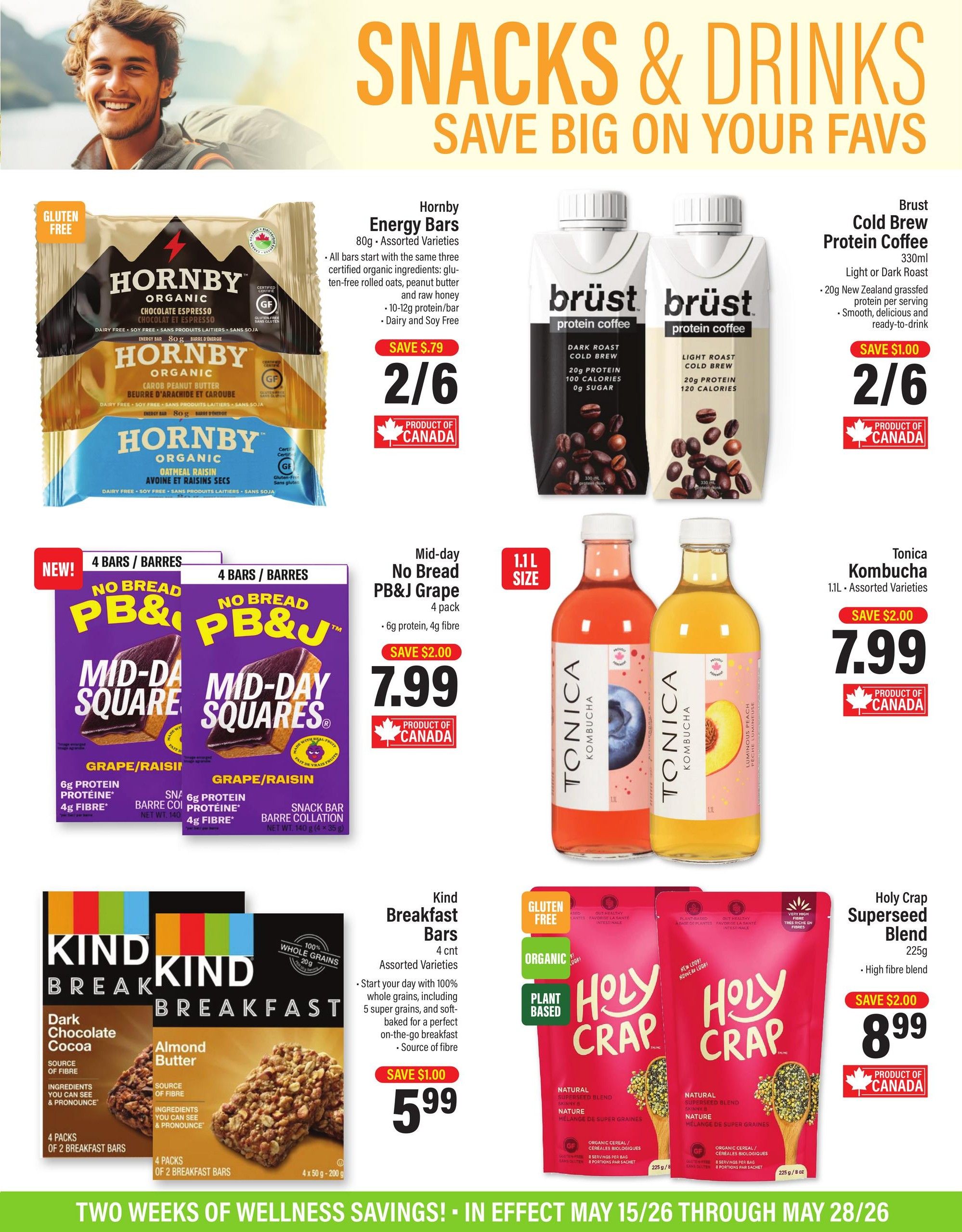 Commisso's Fresh Foods flyer page 4 features a 'Snacks & Drinks Save Big On Your Favs' section. Featured products include Hornby Energy Bars, 80g assorted varieties, on sale for 2 for $6, with a save of $0.79. Brust Cold Brew Protein Coffee, 330ml, in Light or Dark Roast, is on sale for 2 for $6, with a save of $1.00. Mid-day No Bread PB&J Grape Squares, 4 pack, with 6g protein and 4g fibre, is on sale for $7.99, with a save of $2.00. Tonica Kombucha, 1.1L assorted varieties, is on sale for $7.99, with a save of $2.00. Kind Breakfast Bars, 4 count assorted varieties, are on sale for $5.99, with a save of $1.00. Holy Crap Superseed Blend, 225g, is on sale for $8.99, with a save of $2.00. All featured products are 'Product of Canada'. The bottom banner reads 'Two Weeks of Wellness Savings! In Effect May 15/26 Through May 28/26'.