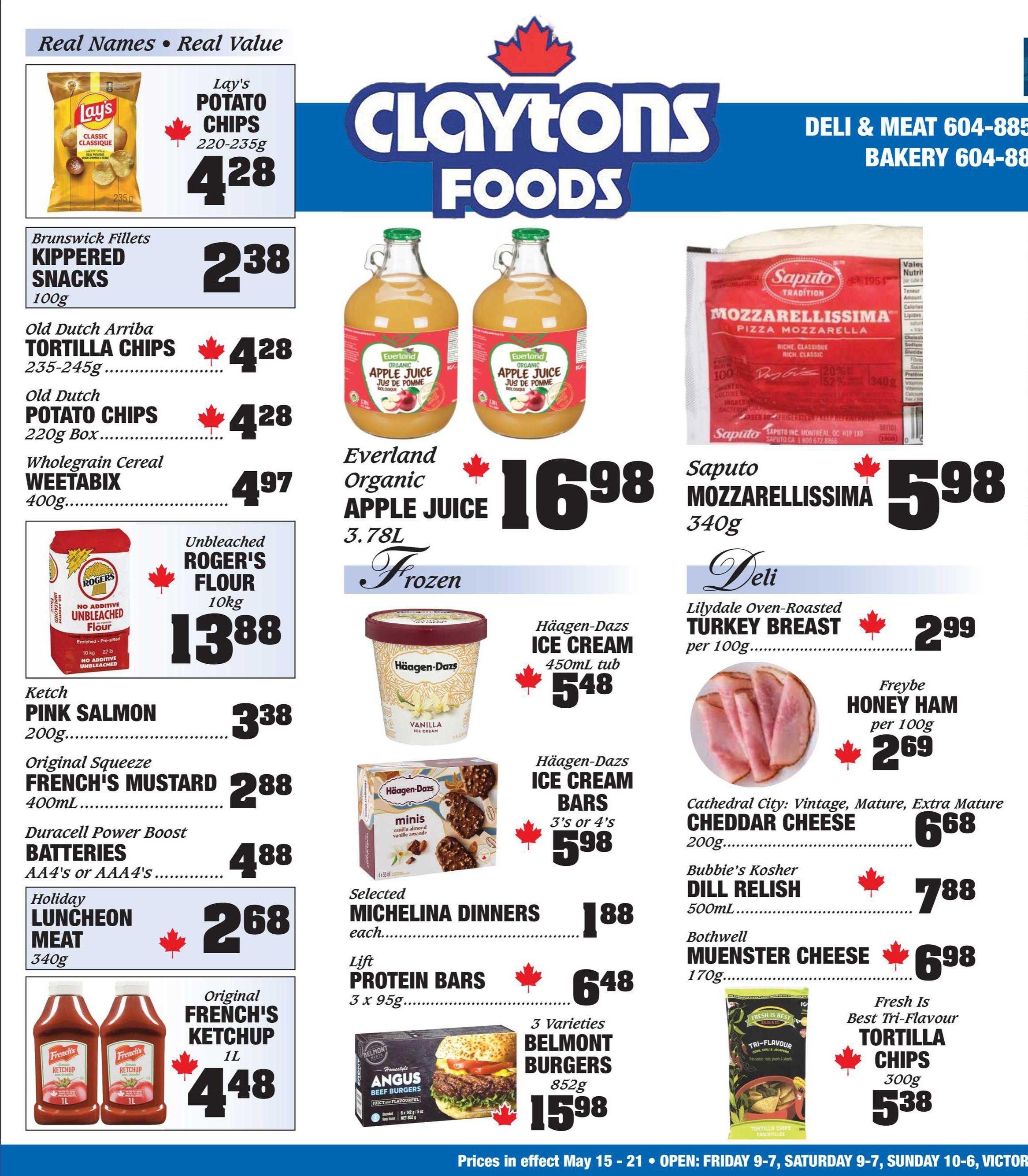 Claytons Foods flyer page 2 featuring various grocery specials. Highlights include Lay's Potato Chips for $4.28, Brunswick Kippered Snacks for $2.38, Old Dutch Arriba Tortilla Chips and Old Dutch Potato Chips for $4.28 each, and Weetabix Whole Grain Cereal for $4.97. Also featured is Unbleached Roger's Flour (10kg) for $13.88, Katch Pink Salmon (200g) for $3.38, Original Squeeze French's Mustard (400mL) for $2.88, Duracell Power Boost Batteries (AA/AAA) for $4.88, and Holiday Luncheon Meat (340g) for $2.68. Two bottles of Original French's Ketchup (1L) are priced at $4.48. On the right side, Everland Organic Apple Juice (3.78L) is $16.98. Deli items include Lilydale Oven-Roasted Turkey Breast for $2.99 per 100g and Freybe Honey Ham for $2.69 per 100g. Cheese options are Saputo Mozzarella (340g) for $5.98, Cathedral City Vintage Mature Extra Mature Cheddar Cheese (200g) for $6.68, and Bothwell Muenster Cheese (170g) for $6.98. Frozen treats include Häagen-Dazs Ice Cream tubs (450mL) for $5.48 and Häagen-Dazs Ice Cream Bars (3's or 4's) for $5.98. Other frozen items are Selected Michelina Dinners for $1.88 each, Lift Protein Bars (3 x 95g) for $6.48, and 3 Varieties Belmont Burgers (852g) for $15.98. Fresh Is Best Tri-Flavour Tortilla Chips (300g) are on sale for $5.38. Bubbies Kosher Dill Relish (500mL) is $7.88.