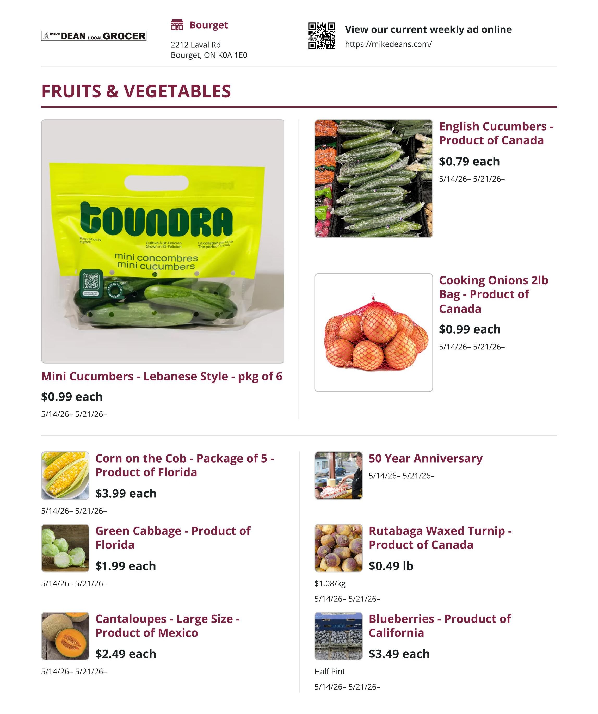 Mike Dean Local Grocer weekly flyer specials page 1, featuring Fruits & Vegetables. On the left, find Mini Cucumbers - Lebanese Style, pkg of 6 for $0.99 each. Below that, Corn on the Cob - Package of 5, Product of Florida for $3.99 each. Next, Green Cabbage - Product of Florida for $1.99 each. Finally, Cantaloupes - Large Size - Product of Mexico for $2.49 each. On the right side, English Cucumbers - Product of Canada are $0.79 each. Cooking Onions 2lb Bag - Product of Canada are $0.99 each. Rutabaga Waxed Turnip - Product of Canada is $0.49 lb. Blueberries - Proudct of California are $3.49 each for a Half Pint. The flyer is valid from May 14 to May 21, 2026.