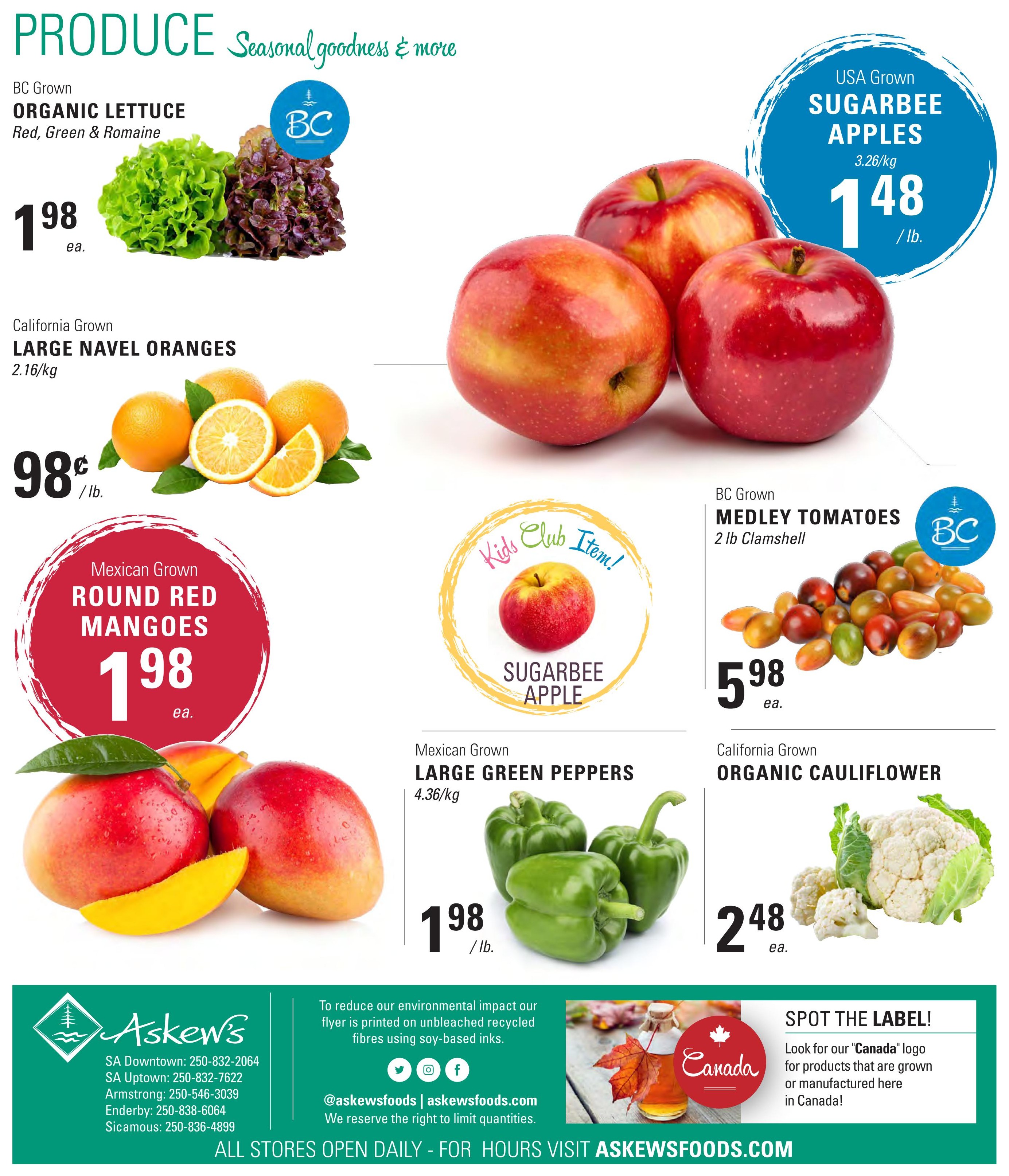 Askew's Foods weekly flyer specials page 12 features a variety of fresh produce. BC Grown Organic Lettuce (Red, Green & Romaine) is $1.98 each. California Grown Large Navel Oranges are $0.98 per pound. Mexican Grown Round Red Mangoes are $1.98 each. USA Grown Sugarbee Apples are $1.48 per pound. BC Grown Medley Tomatoes (2 lb Clamshell) are $5.98 each. Mexican Grown Large Green Peppers are $1.98 per pound. California Grown Organic Cauliflower is $2.48 each. The page also highlights a 'Canada' logo for locally grown or manufactured products.