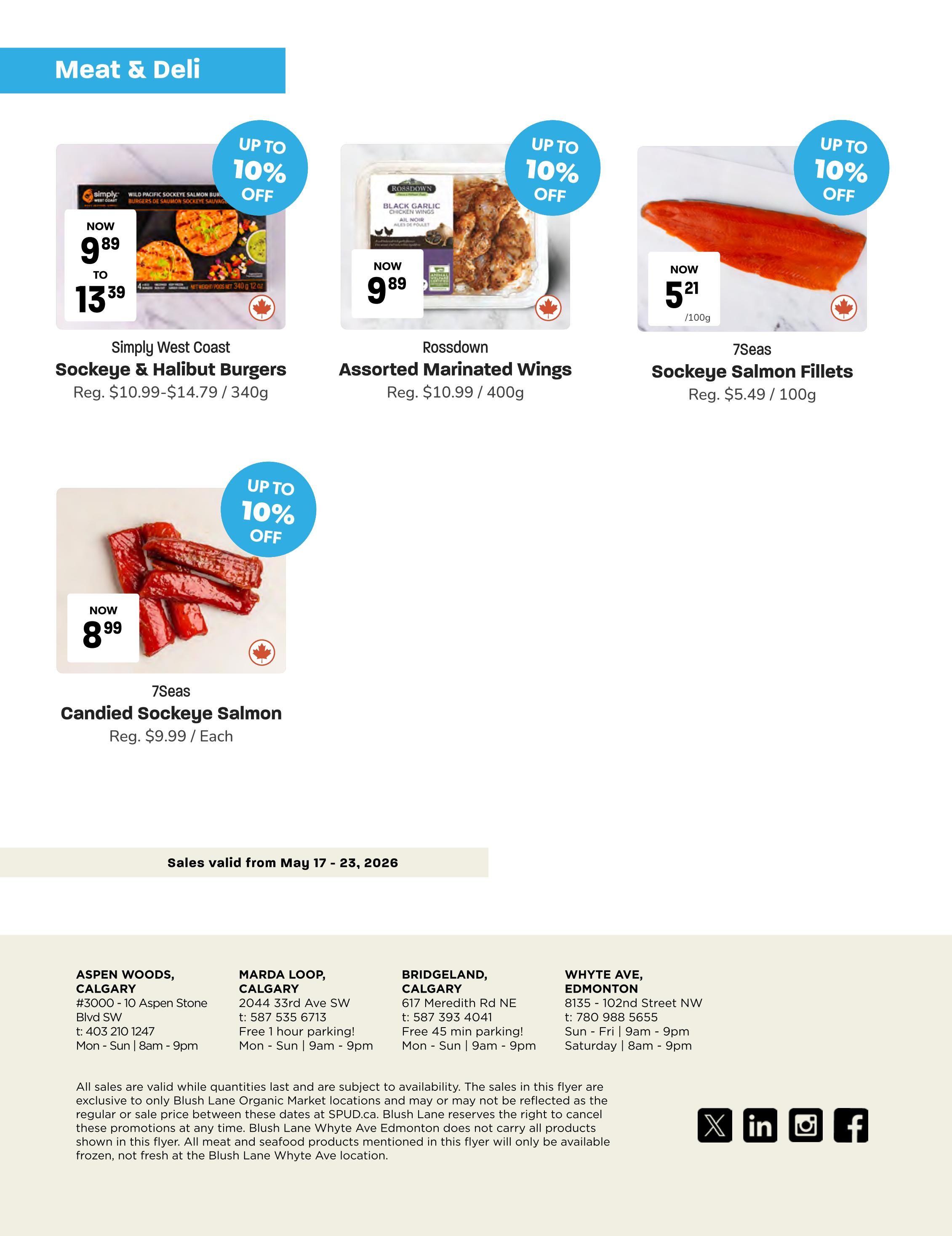 Blush Lane Organic Market weekly flyer specials page 4 features meat and deli items. On sale are Simply West Coast Sockeye & Halibut Burgers, now $9.89 to $13.39 (regularly $10.99-$14.79) for 340g, with up to 10% off. Rossdown Assorted Marinated Wings are also up to 10% off, now $9.89 for 400g (regularly $10.99). 7Seas Sockeye Salmon Fillets are up to 10% off, now $5.21 per 100g (regularly $5.49 per 100g). Additionally, 7Seas Candied Sockeye Salmon is on special for $8.99 each (regularly $9.99), also with up to 10% off. Sales are valid from May 17-23, 2026. Store locations in Calgary and Edmonton are listed with addresses and hours.