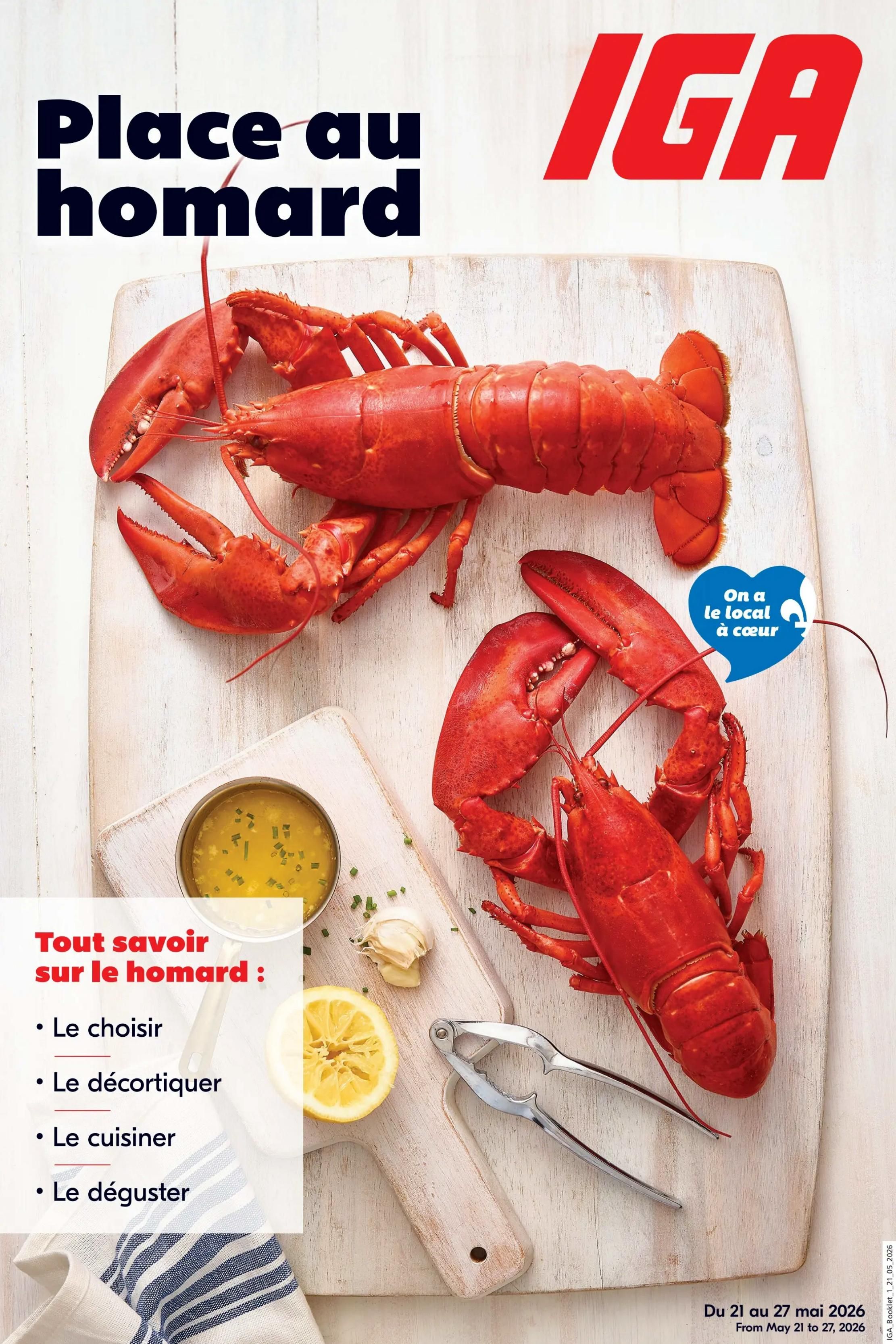 IGA weekly flyer specials, page 21, featuring a 'Lobster Season' theme. The page showcases whole cooked lobsters on a wooden cutting board, accompanied by a small bowl of melted butter with chives, a lemon half, and a lobster cracker. Text highlights 'Everything you need to know about lobster: How to choose, how to shell, how to cook, and how to enjoy.' A blue heart graphic states 'We love local.' The flyer is valid from May 21 to May 27, 2026.