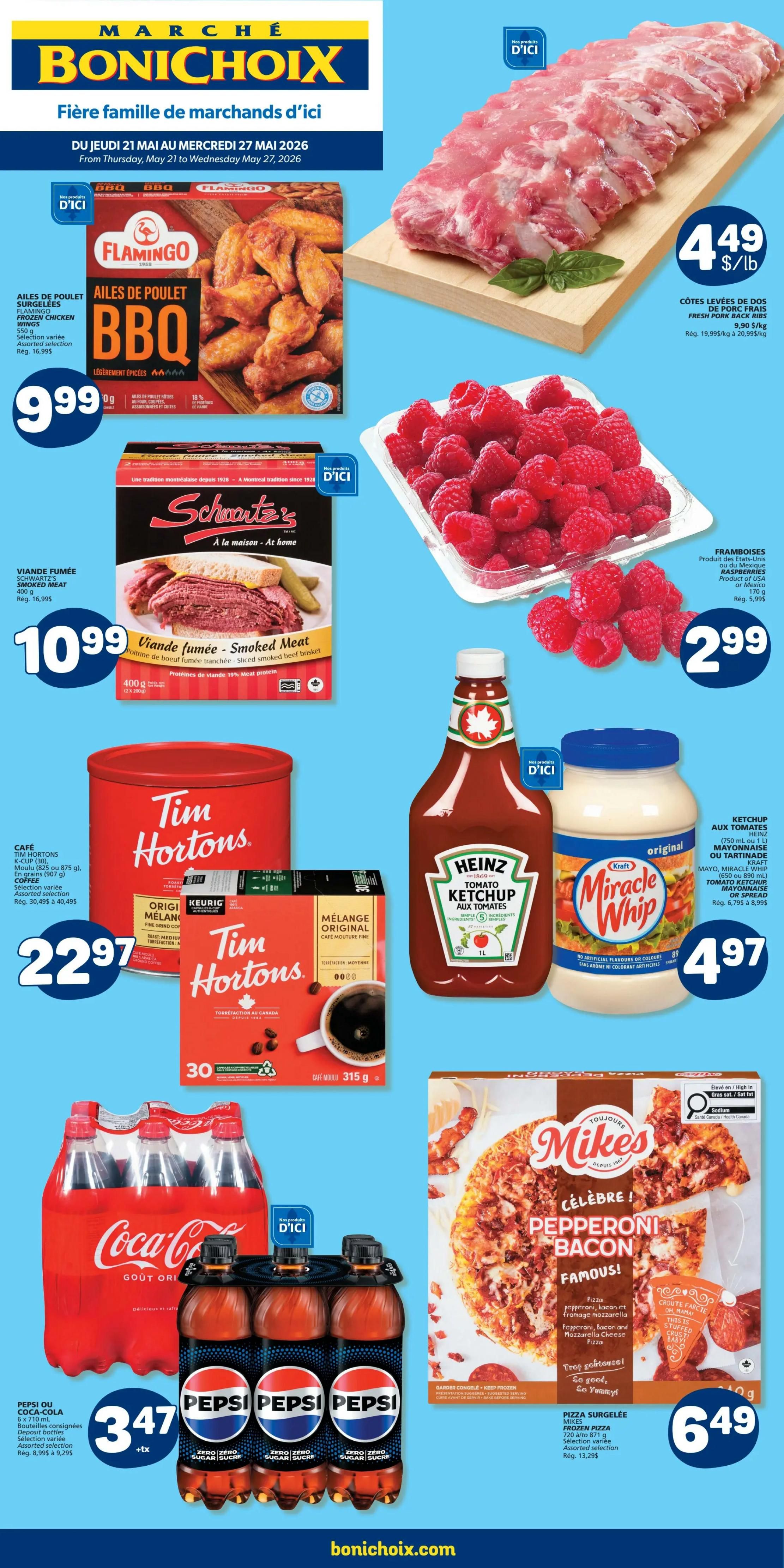 Marché Bonichoix flyer page 1 featuring weekly specials from Thursday, May 21 to Wednesday, May 27, 2026. Highlights include fresh pork back ribs for $4.49/lb, Flamingo BBQ frozen chicken wings for $9.99, Schwartz's smoked meat for $10.99, and fresh raspberries for $2.99. Also featured are Tim Hortons coffee (K-Cup or ground) for $22.97, Heinz tomato ketchup and Kraft Miracle Whip for $4.97, Coca-Cola or Pepsi 6 x 710 mL deposit bottles for $3.47, and Mike's frozen pepperoni bacon pizza for $6.49.