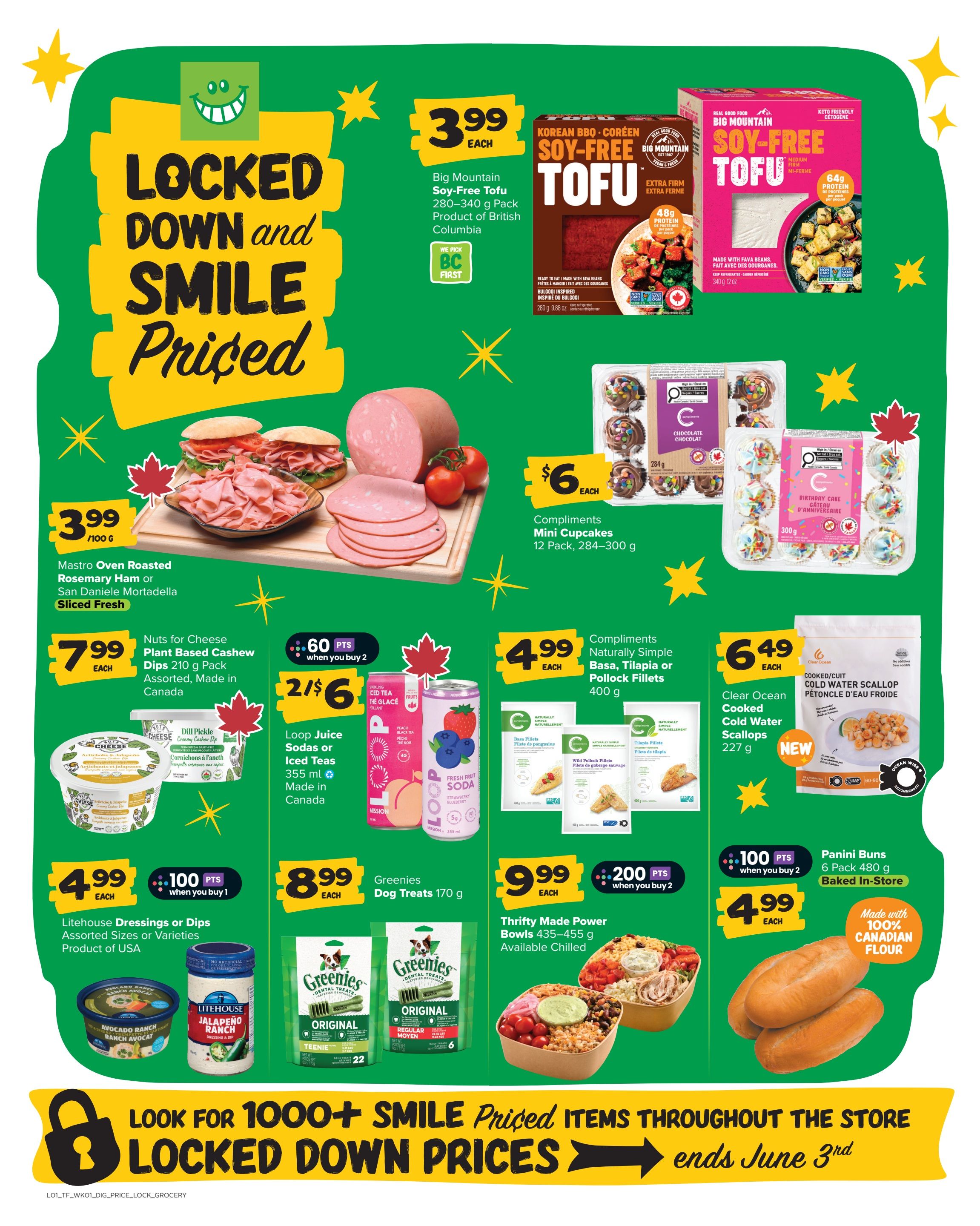 Thrifty Foods weekly flyer specials page 15 features 'Locked Down and Smile Priced' deals. Highlights include Big Mountain Soy-Free Tofu in Korean BBQ or Original flavour for $3.99 each, and Mastro Oven Roasted Rosemary Ham or San Daniele Mortadella Sliced Ham for $3.99 per 100g. Also featured are Nuts for Cheese Plant Based Cashew Dips for $7.99 each, Loop Juice Sodas or Iced Teas for 2 for $6, and Compliments Mini Cupcakes (12 pack) for $6 each. Compliments Naturally Simple Basa, Tilapia or Pollock Fillets are $4.99 each. Clear Ocean Cooked Cold Water Scallops are $6.49. Greenies Dog Treats are $8.99 each. Thrifty Made Power Bowls (435-455g) are $9.99 each and earn 200 points when you buy 2. Panini Buns (6 pack) are $4.99 each and made with 100% Canadian flour. The flyer also promotes '1000+ Smile Priced Items Throughout the Store' ending June 3rd.