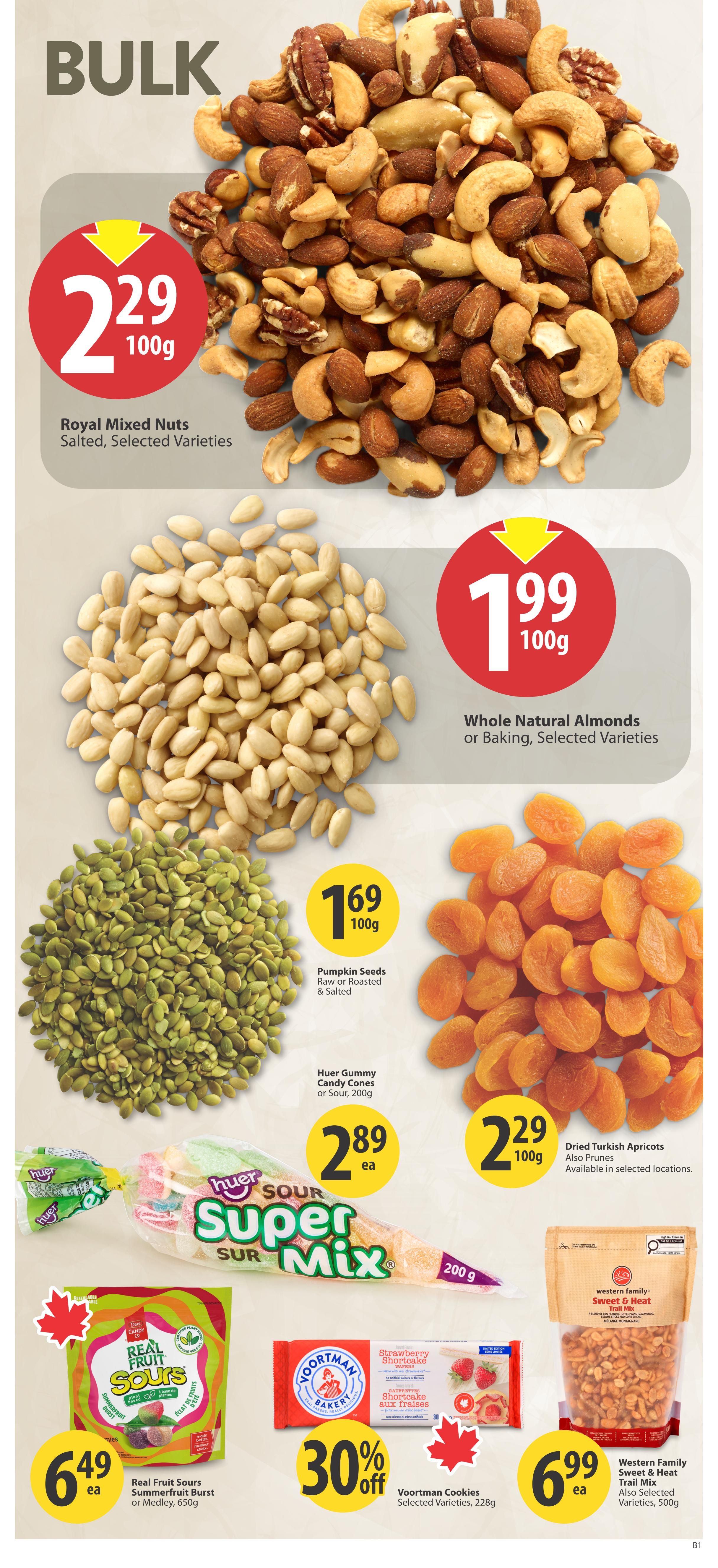 Save-On-Foods weekly flyer specials page 25 features bulk food items. Royal Mixed Nuts, salted and selected varieties, are priced at $2.29 per 100g. Whole Natural Almonds for baking or selected varieties are $1.99 per 100g. Pumpkin Seeds, raw or roasted and salted, are $1.69 per 100g. Huer Gummy Candy Cones, or Sour, 200g, are $2.89 each. Dried Turkish Apricots, also available as prunes, are $2.29 per 100g. Real Fruit Sours Summerfruit Burst or Medley, 650g, are $6.49 each. Voortman Cookies, selected varieties, 228g, are 30% off. Western Family Sweet & Heat Trail Mix, also selected varieties, 500g, is $6.99 each.