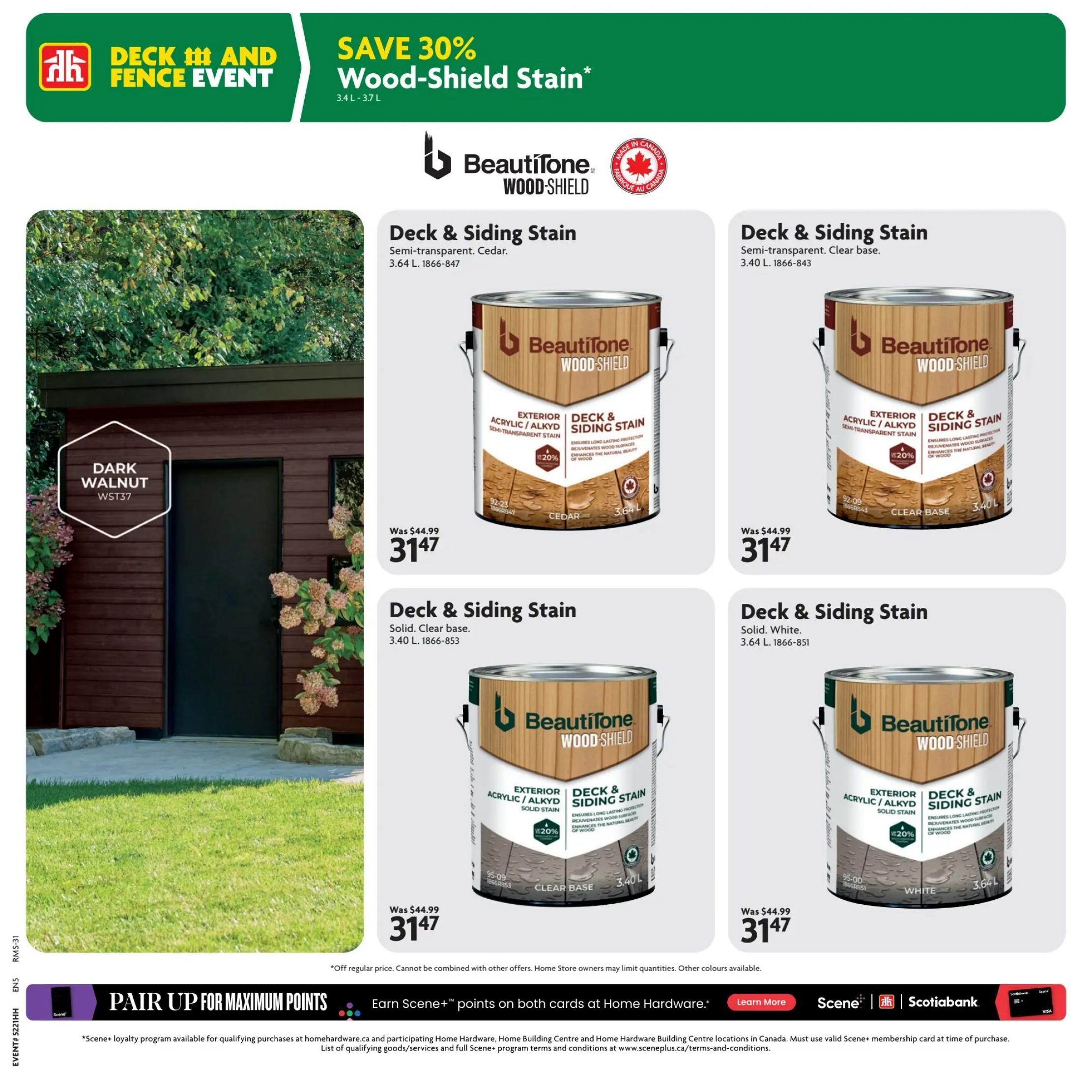 Home Hardware flyer specials page featuring the Deck and Fence Event with a 30% saving on Beautitone Wood-Shield Stain. Featured products include Beautitone Wood-Shield Deck & Siding Stain in Semi-transparent Cedar (3.64 L) for $31.47, originally $44.99, and Semi-transparent Clear base (3.40 L) for $31.47, originally $44.99. Also shown is a can of Solid White (3.64 L) Deck & Siding Stain for $31.47, originally $44.99. A large image on the left showcases a shed painted in the Dark Walnut WST37 colour. The bottom of the page highlights a promotion to 'Pair Up for Maximum Points' with Scene+ and Scotiabank, offering Scene+ points on both cards at Home Hardware.
