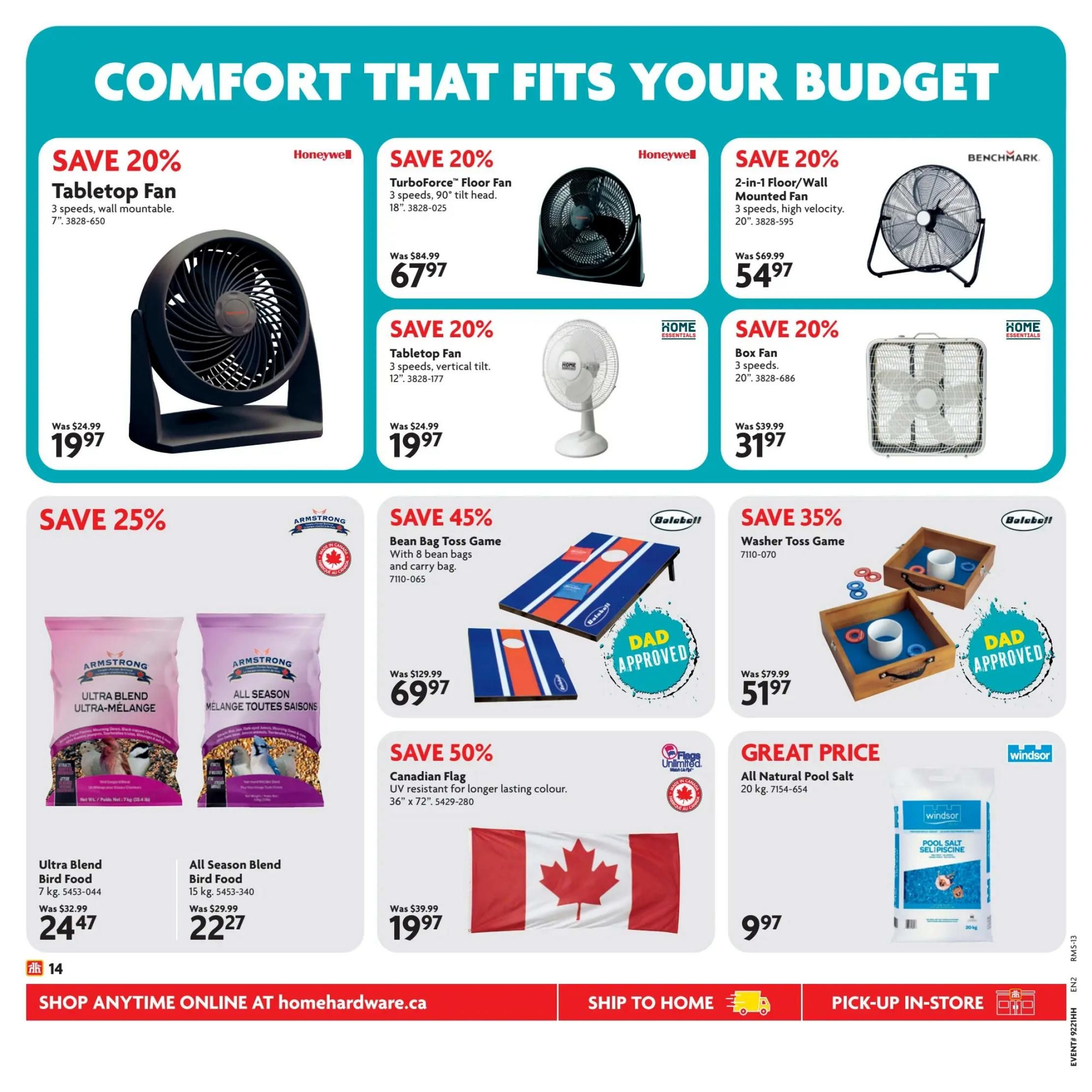 Home Hardware flyer page 15 featuring 'Comfort That Fits Your Budget'. Top row includes: Save 20% on a Honeywell Tabletop Fan for $19.97 (was $24.99), Save 20% on a Honeywell TurboForce Floor Fan for $67.97 (was $84.99), and Save 20% on a Benchmark 2-in-1 Floor/Wall Mounted Fan for $54.97 (was $69.99). Second row includes: Save 20% on a Home Essentials Tabletop Fan for $19.97 (was $24.99), Save 20% on a Home Essentials Box Fan for $31.97 (was $39.99). Bottom row features: Save 25% on Armstrong Ultra Blend Bird Food (7 kg) for $24.47 (was $32.99), Save 25% on Armstrong All Season Blend Bird Food (15 kg) for $22.27 (was $29.99). Also on this row: Save 45% on a Balaball Bean Bag Toss Game with 8 bean bags and carry bag for $69.97 (was $129.99), Save 35% on a Balaball Washer Toss Game for $51.97 (was $79.99), Save 50% on a Canadian Flag (36' x 72') for $19.97 (was $39.99), and a Great Price on Windsor All Natural Pool Salt (20 kg) for $9.97. The bottom banner shows 'Shop Anytime Online at homehardware.ca', 'Ship to Home', and 'Pick-up In-Store'.